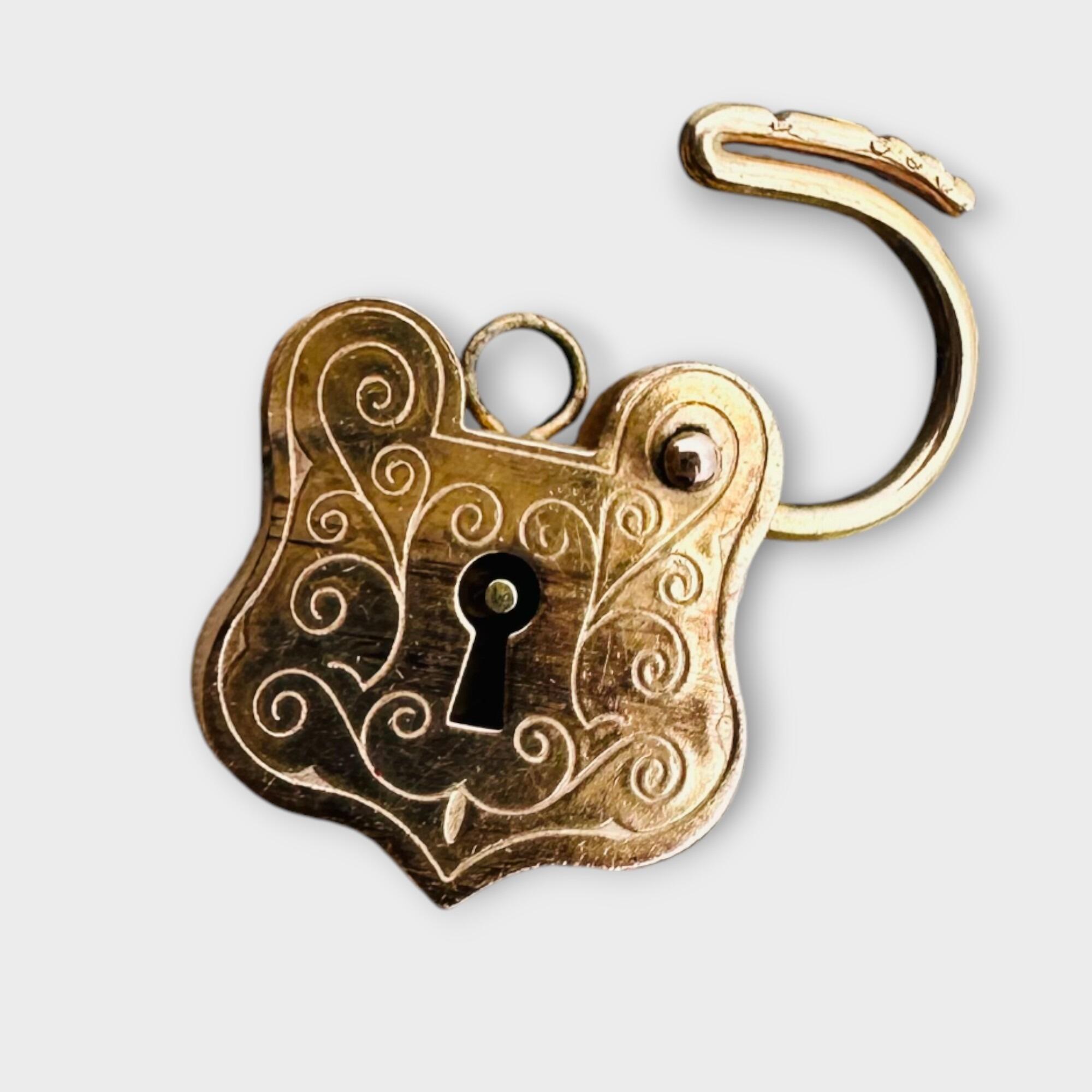 Rare, Romantic Antique 9k Rose Gold Shield Padlock open Clasp, grey background.