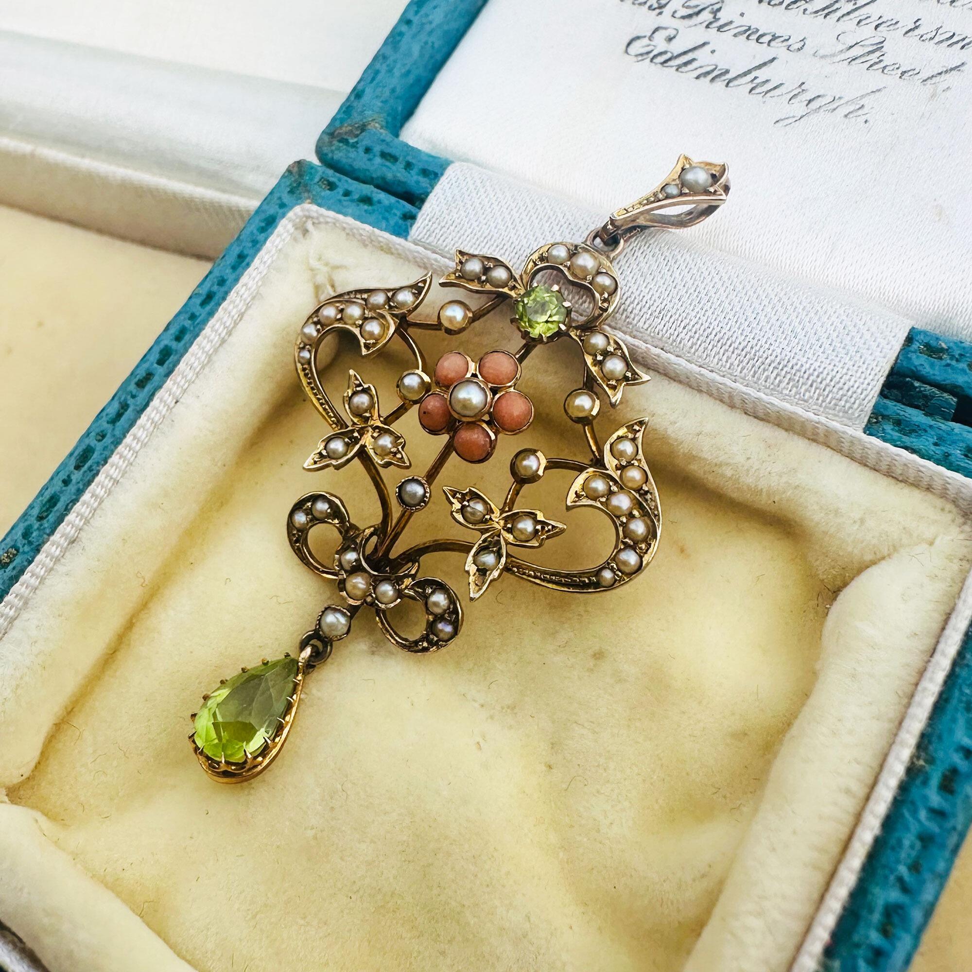 Art Nouveau 9k gold Lavaliere Pendant Peridot & Pearl Floral Motif, displayed in antique box.