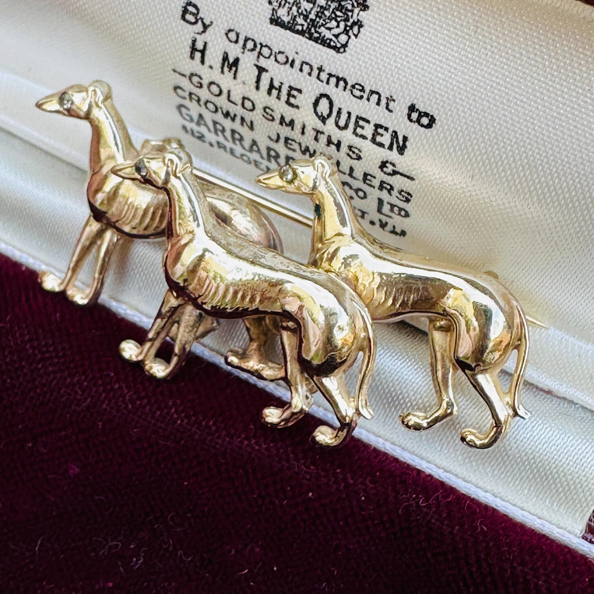 Rare, Antique 15k Gold Triple Greyhound Brooch with Diamond Eyes , displayed in antique box.