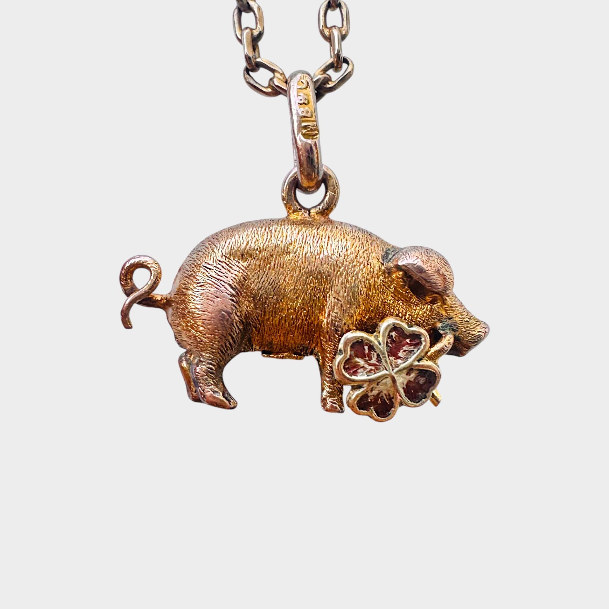 side view, Murrle Bennett, Gold Lucky Pig Charm Holding Four-Leaf Clover, grey background