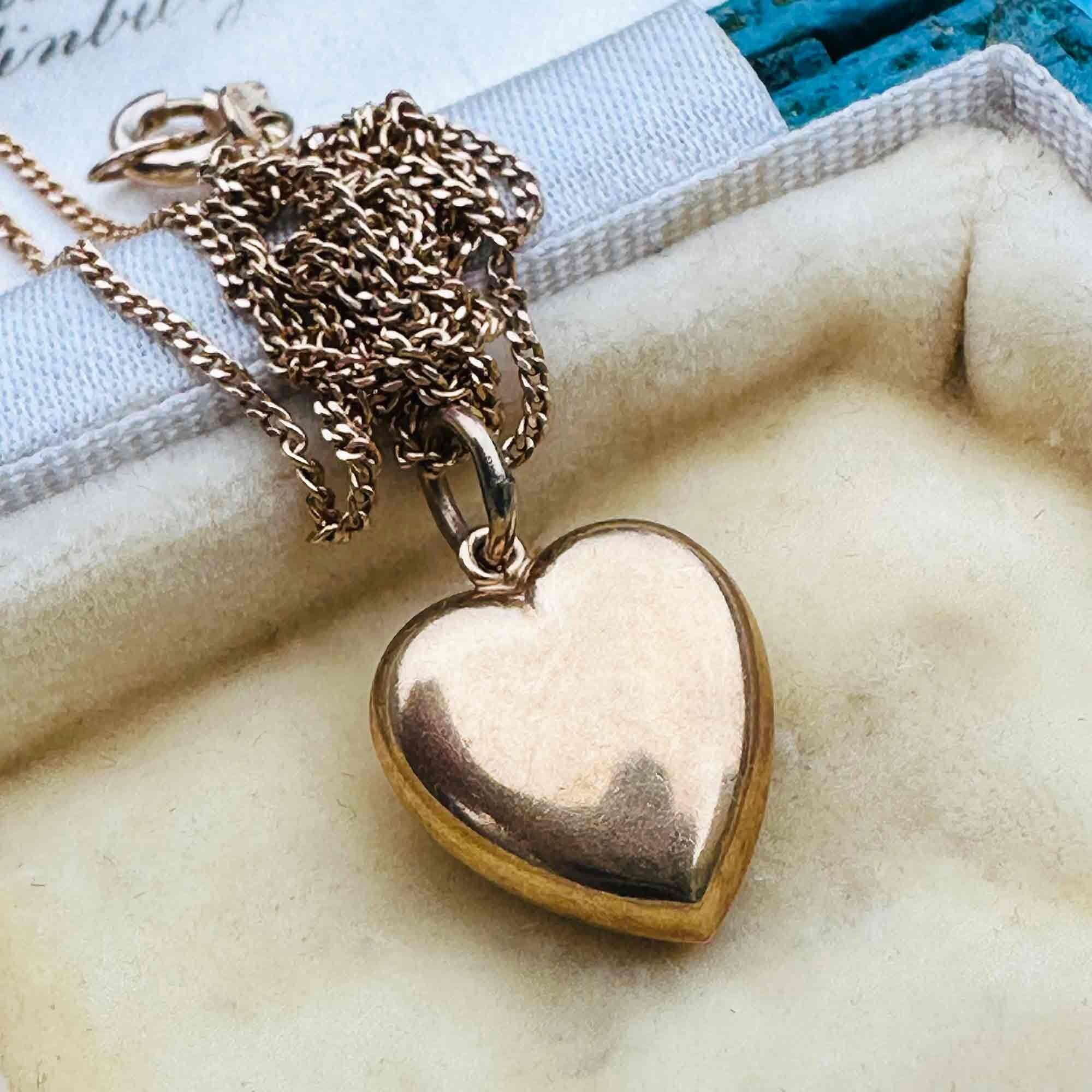 Gold Puffy Heart Necklace with Chain Dating 1942, displayed in a antique box.