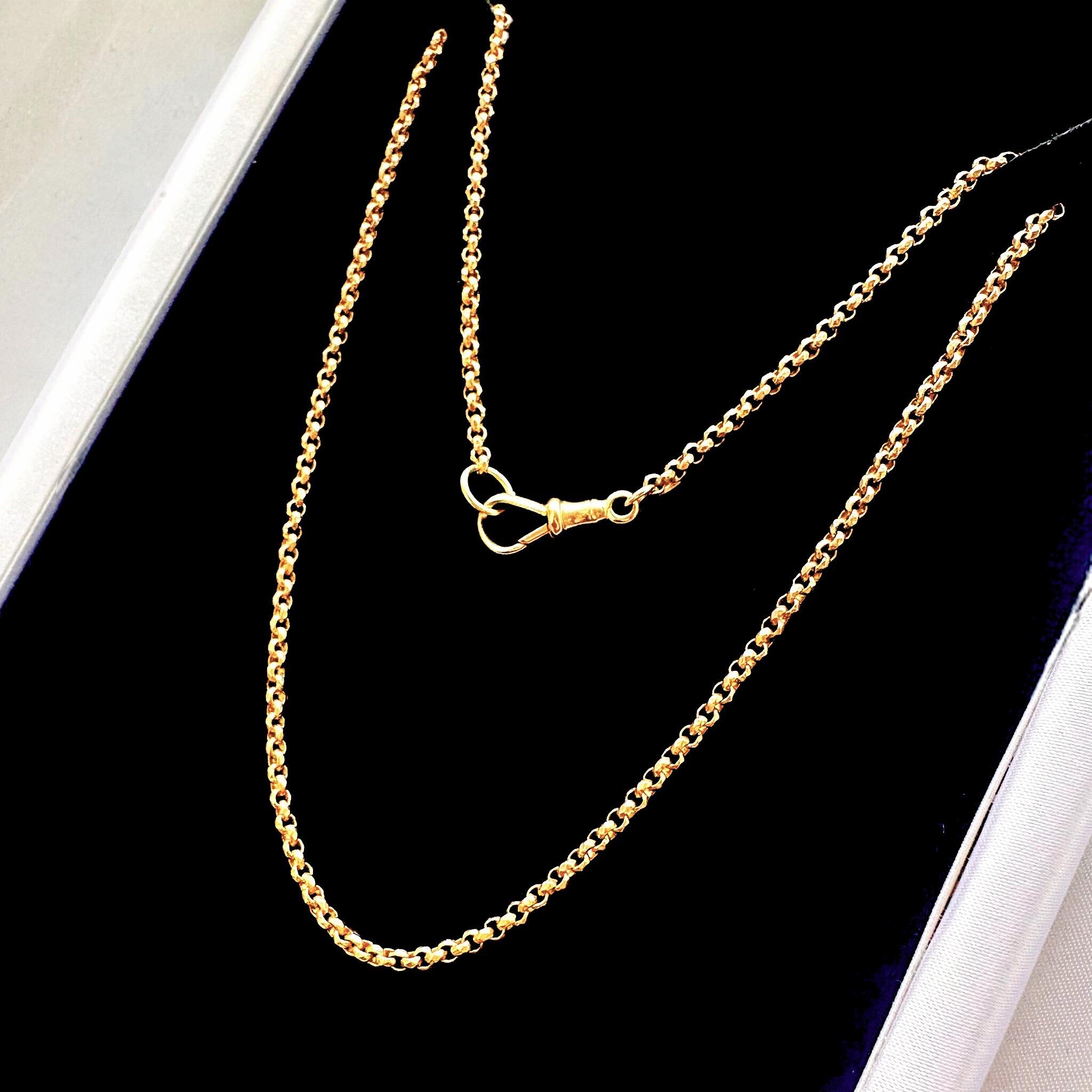 Rose Gold Faceted Belcher Chain with Dog Clip Clasp displayed on black velvet.