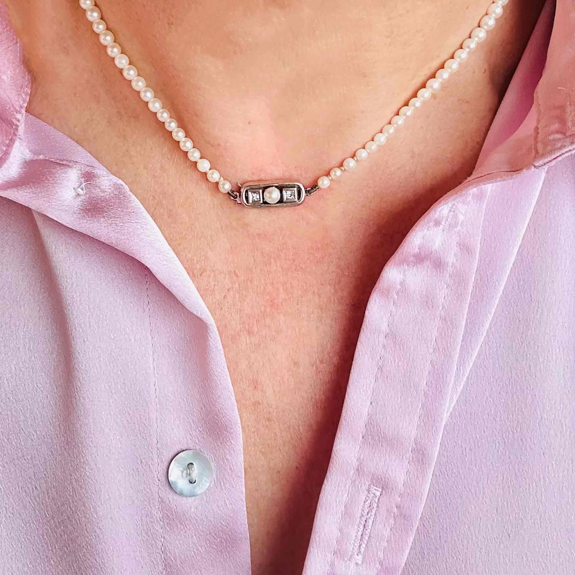 Saltwater Cultured Pearl & 14ct White Gold Diamond Clasp Necklace, displayed on models neck.
