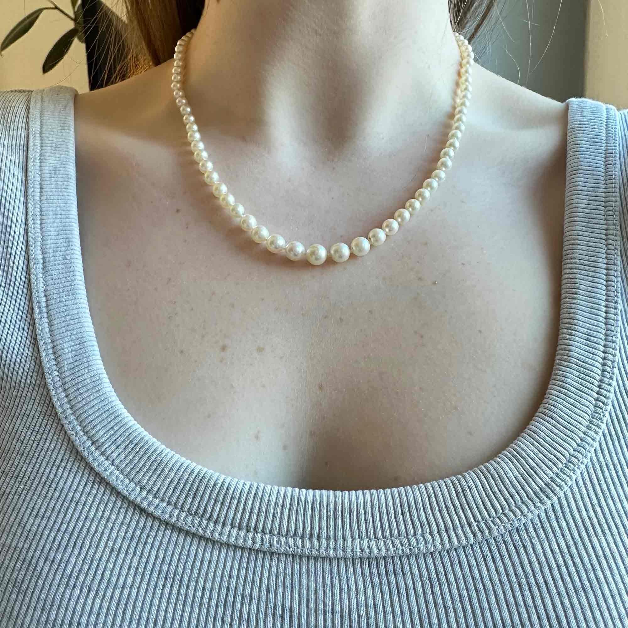 14ct White Gold & Diamond Saltwater Cultured Pearl Necklace worn around models neck