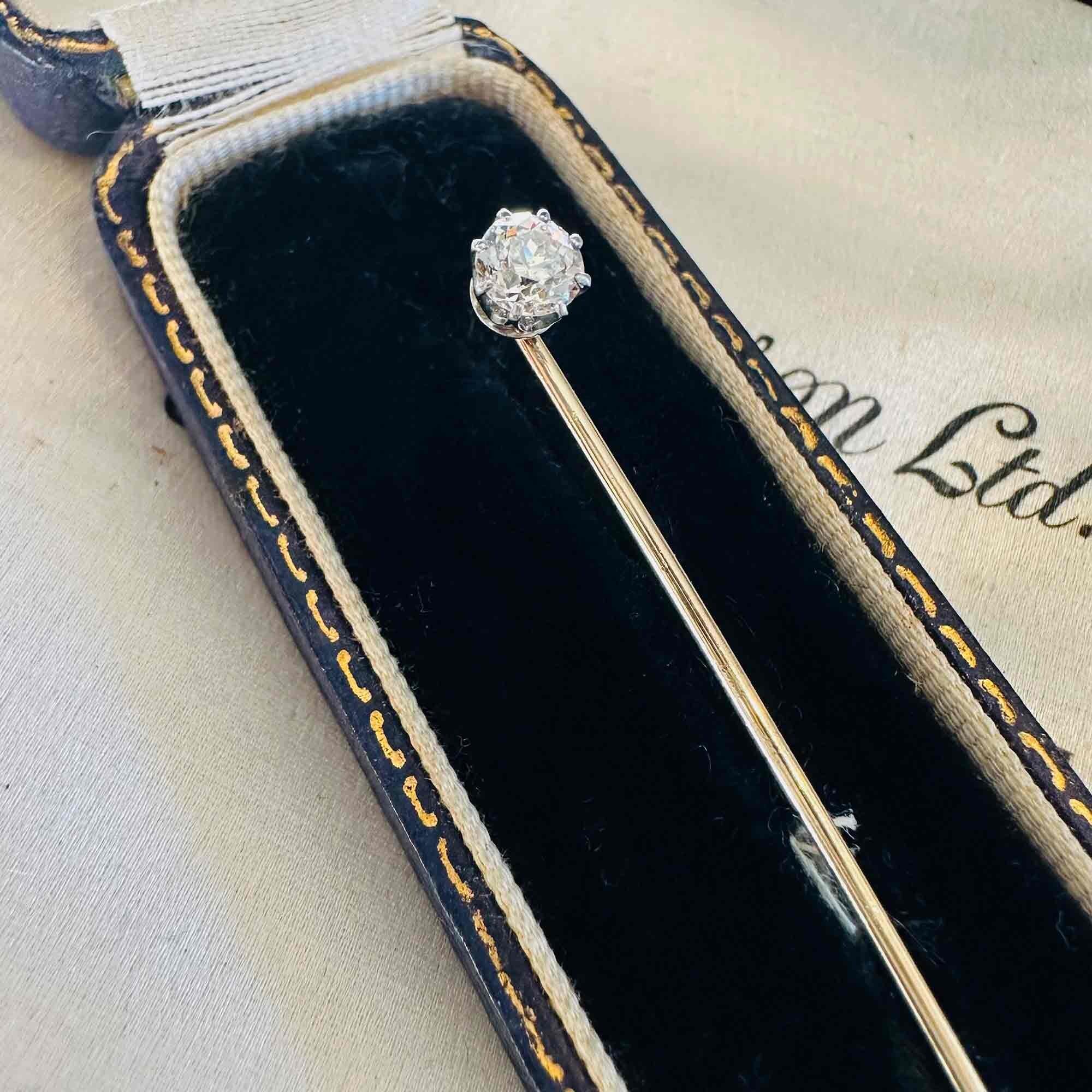 Edwardian 0.48ct Old European Cut Diamond Stick Pin & Original Box laying on other antique boxes