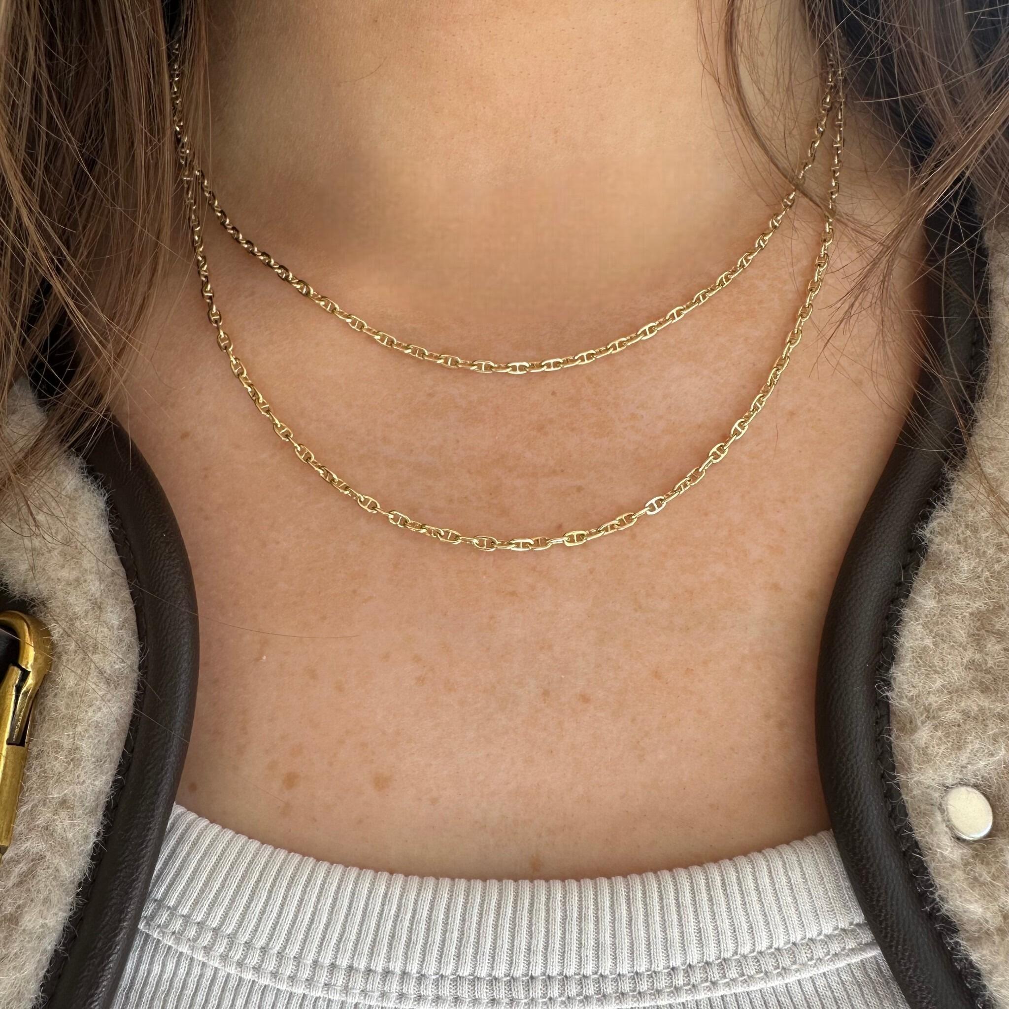 Gold Mariner Anchor Link Chain Necklace layered and worn on models neck