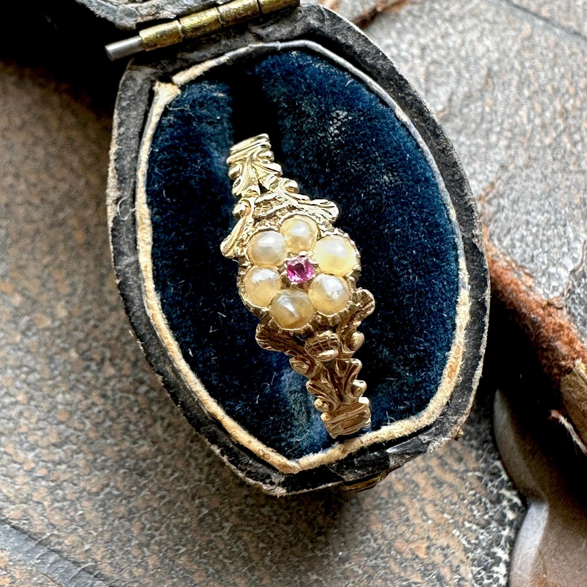 side view of Antique Georgian Regency Pearl & Ruby Daisy Ring displayed in antique box