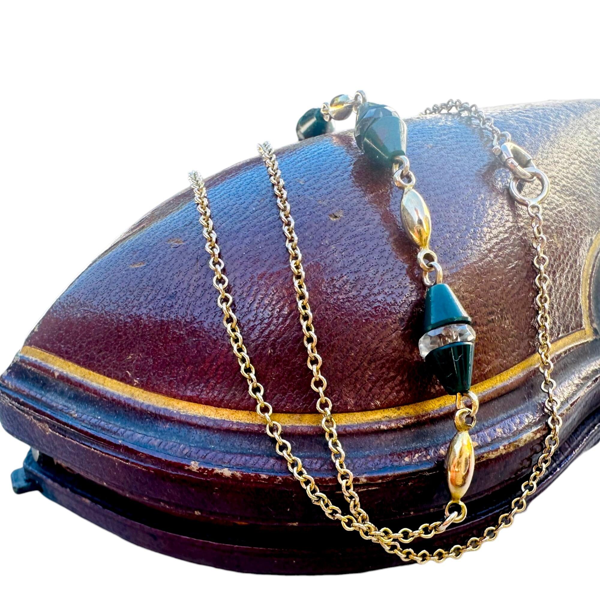 Antique Art Deco 9k Gold Bloodstone & Rock Crystal Bead Chain displayed on red leather box with white background