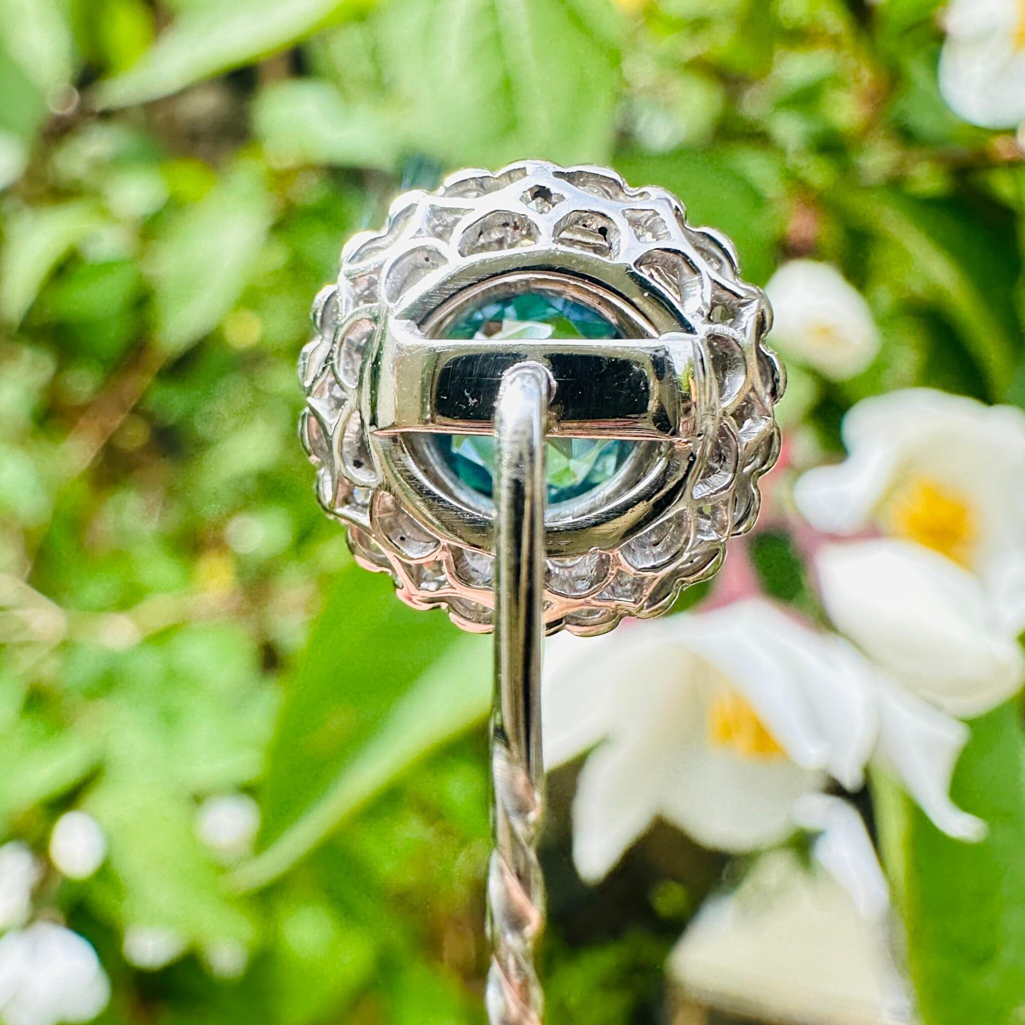 Antique Art Deco Platinum Blue Zircon & Diamond Stick Pin displayed in garden