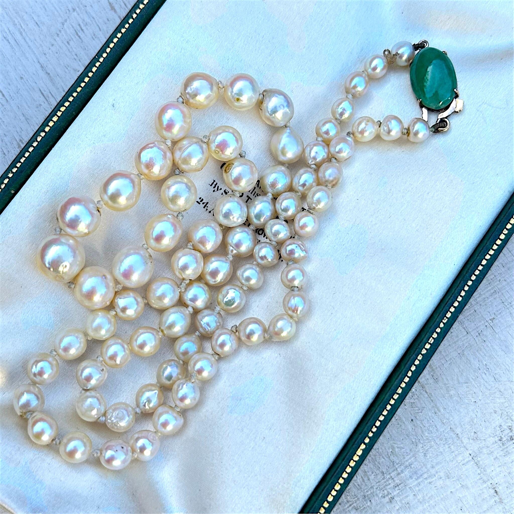 Antique Cultured Saltwater Baroque Pearl & 14k Gold Jadeite Clasp Necklace displayed on antique box