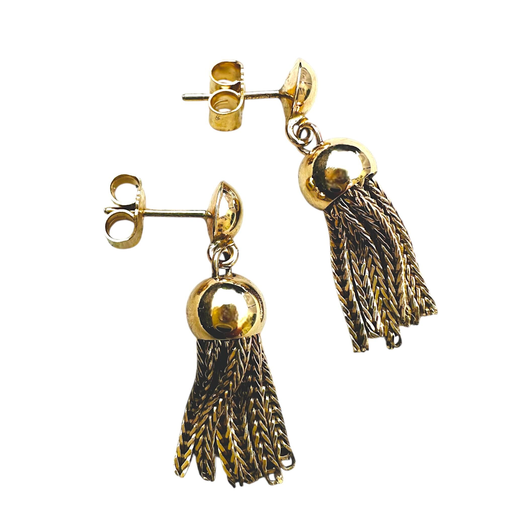 side profile of Vintage Gold Tassel Drop Earrings with white background
