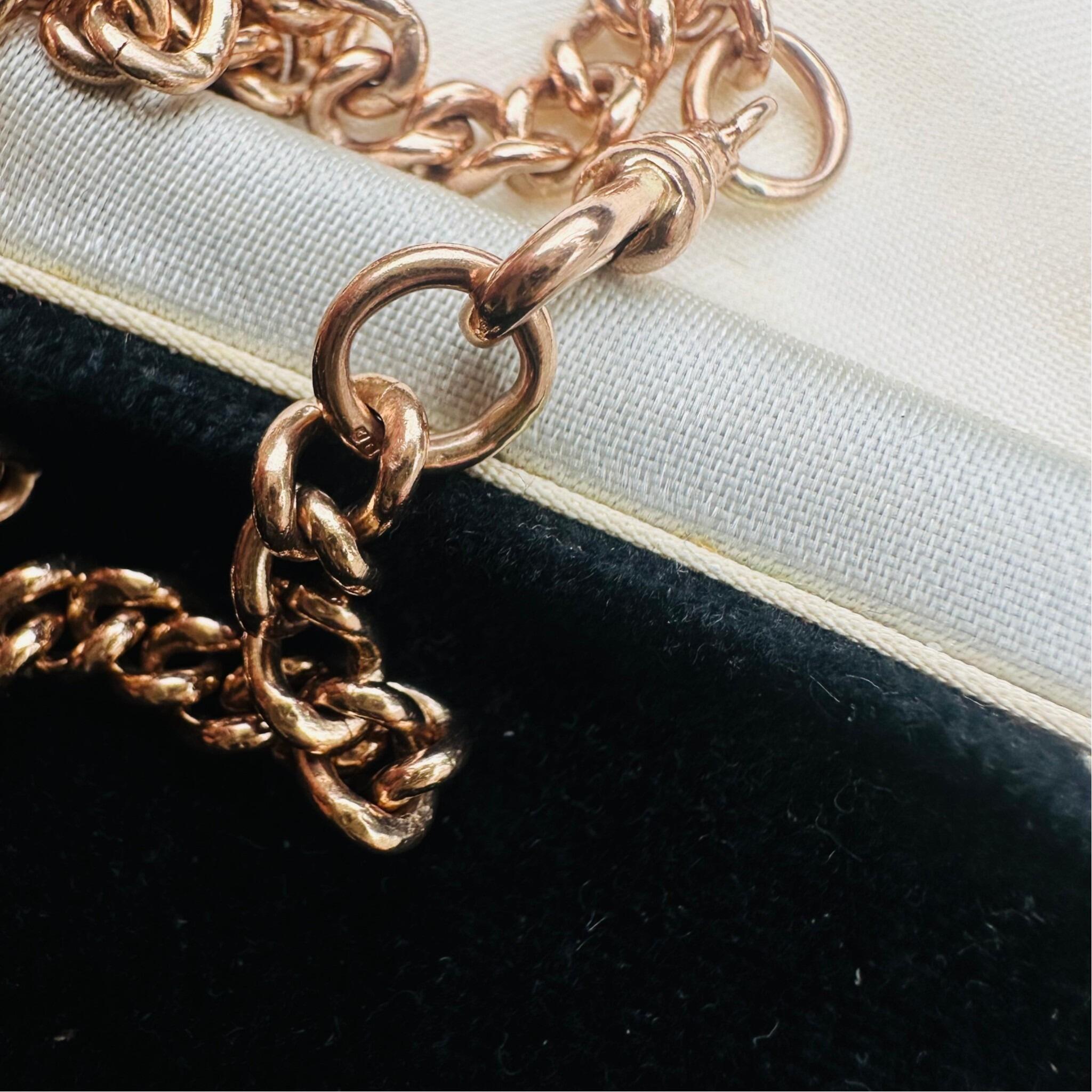 Antique Rose Gold Curb Link & Dog Clip Bracelet laying on antique box
