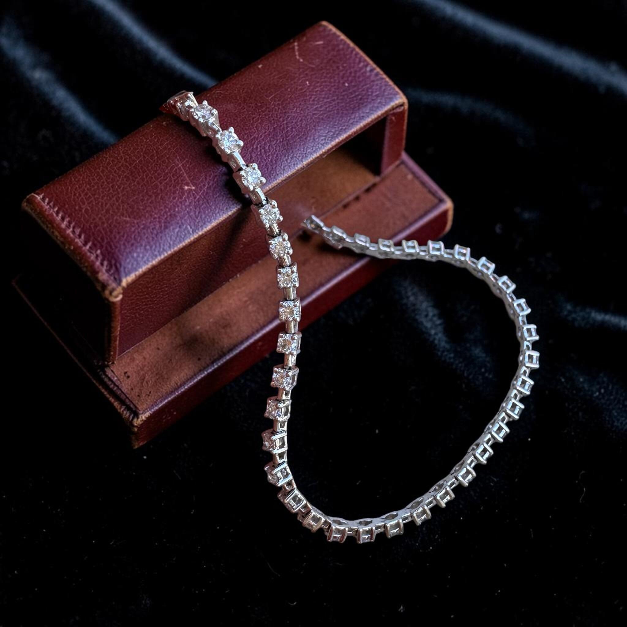 18K White Gold Diamond Tennis Bracelet displayed on red antique box, with black background