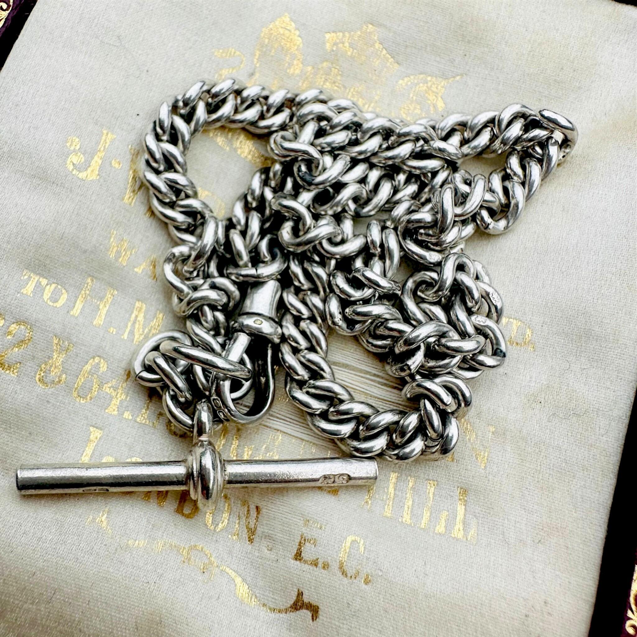 Antique Edwardian Sterling Silver Albert Chain, T Bar & Dog Clip displayed on antique box