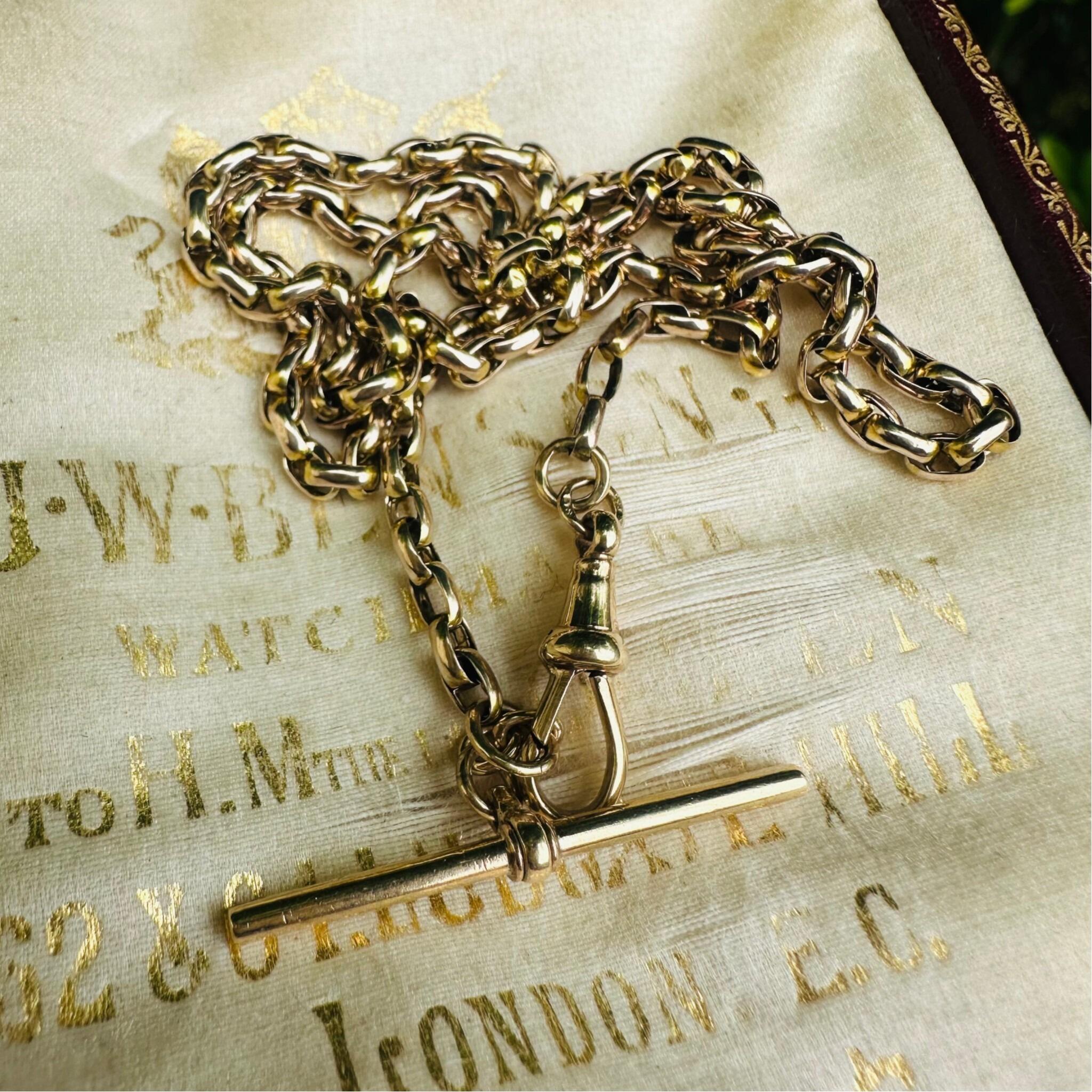 Antique Victorian Gold Bike Link Chain, Dog Clip & T-bar Clasp displayed on antique box