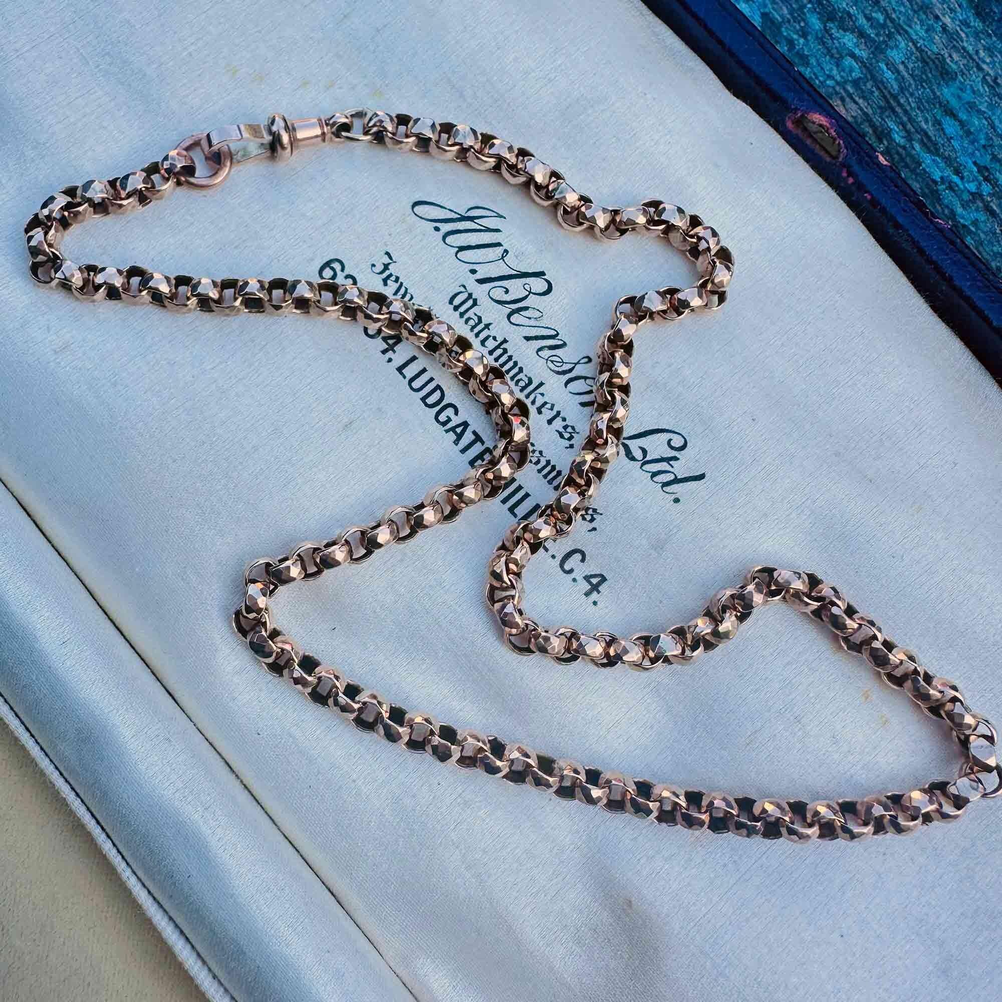 Antique 9ct gold chain with faceted links catching the light, highlighting the Victorian-era design and craftsmanship