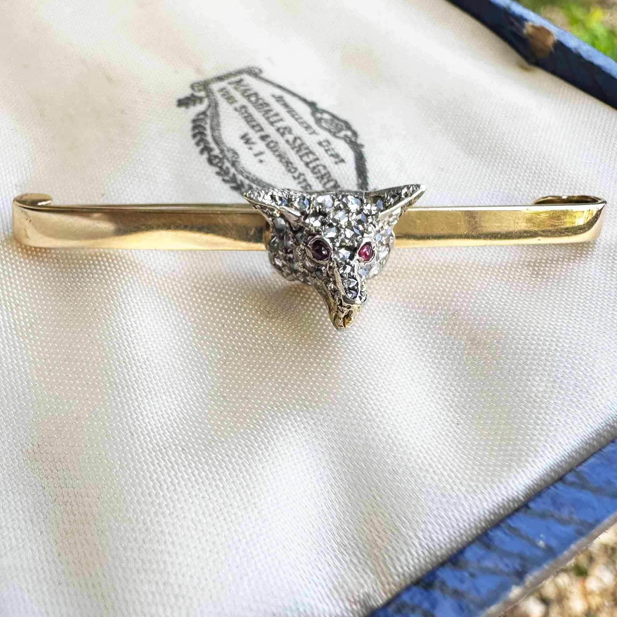 Antique diamond fox head brooch with rose cut diamonds, ruby eyes, and gold teeth detail