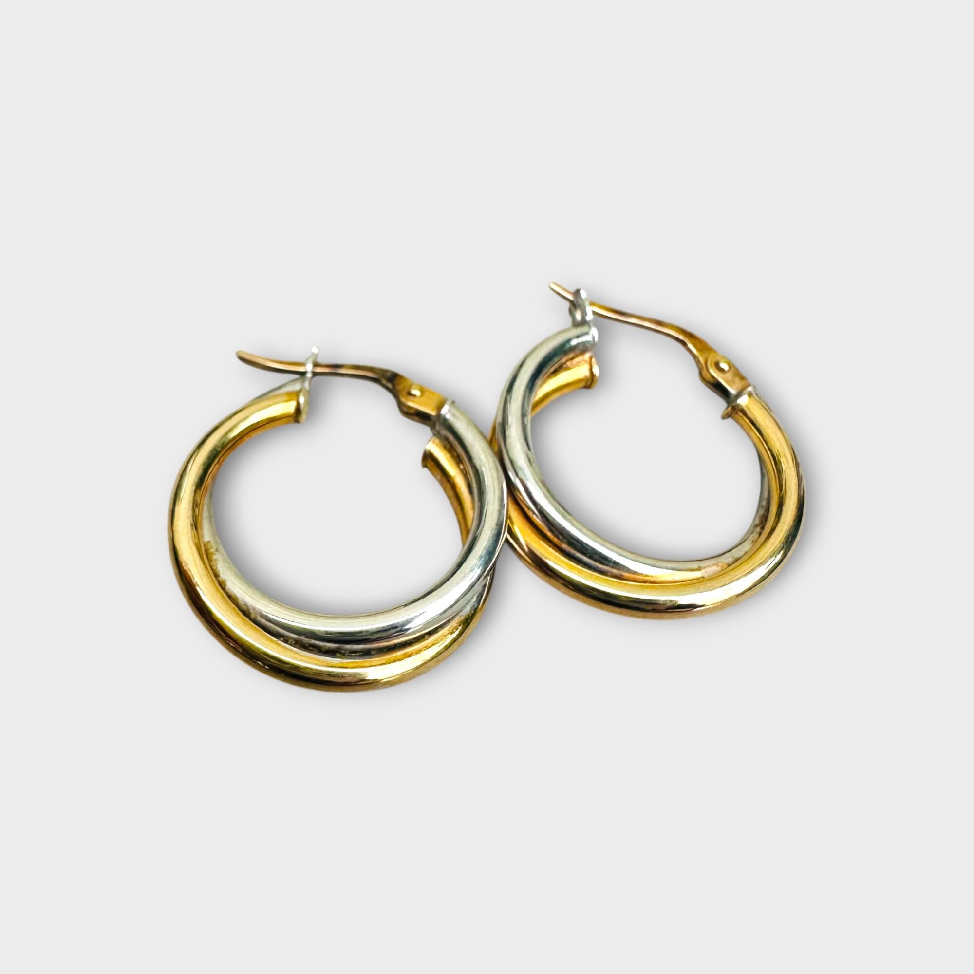 Italian bi-colour 9k gold hoop earrings on grey background.