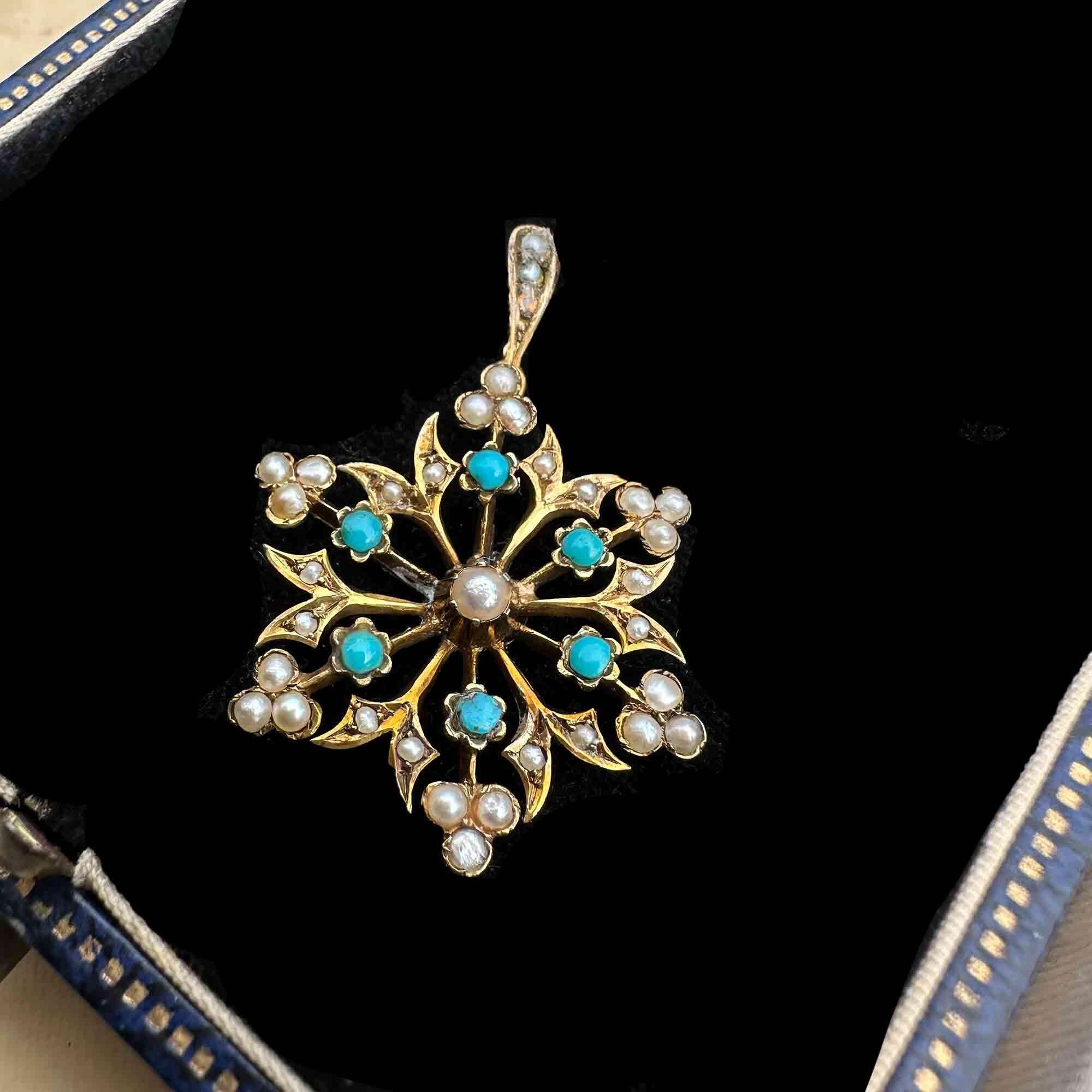 antique 9ct gold Turquoise and pearl starburst pendant on black velvet antique box.