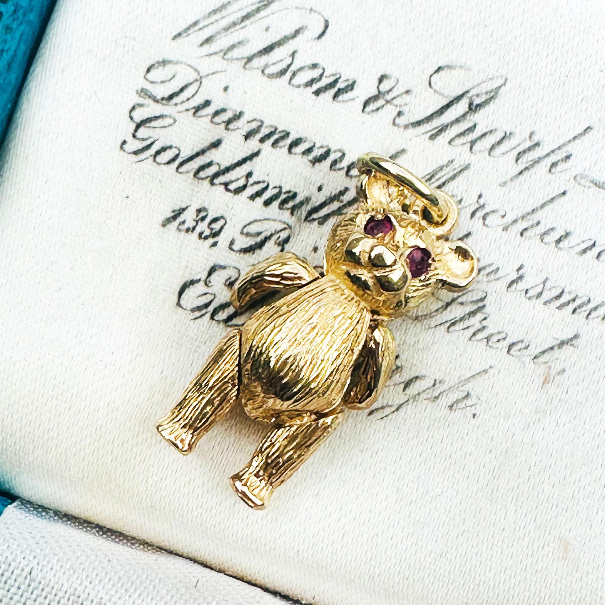 Vintage 9ct Gold Teddy Bear Pendant: Ruby Eyes, Articulated London Charm displayed in antique box