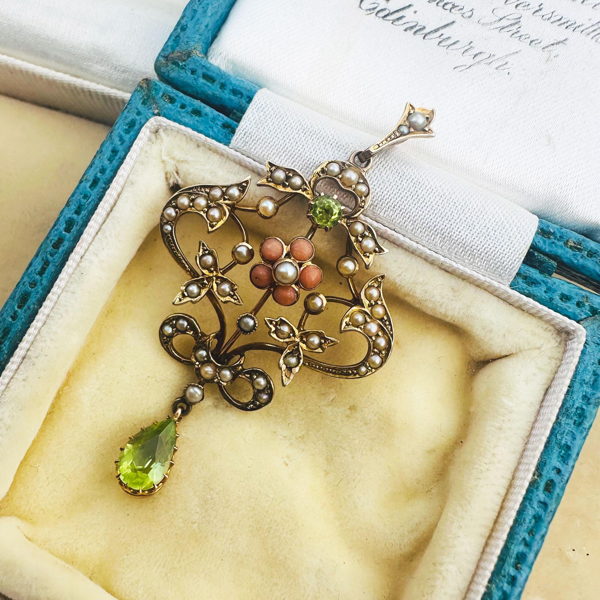 Art Nouveau 9k gold Lavaliere Pendant Peridot & Pearl Floral Motif, displayed in antique box.