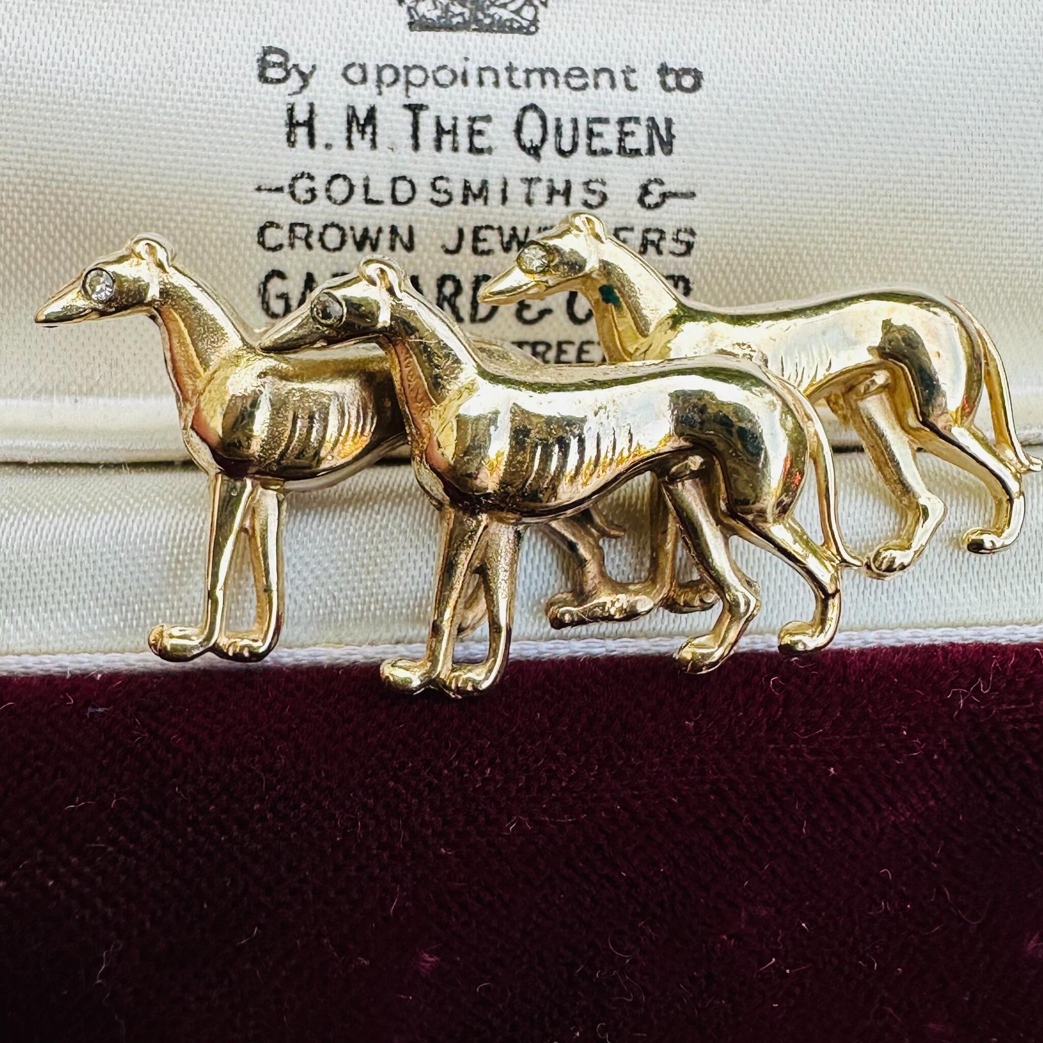Rare, Antique 15k Gold Triple Greyhound Brooch with Diamond Eyes, displayed in antique box.