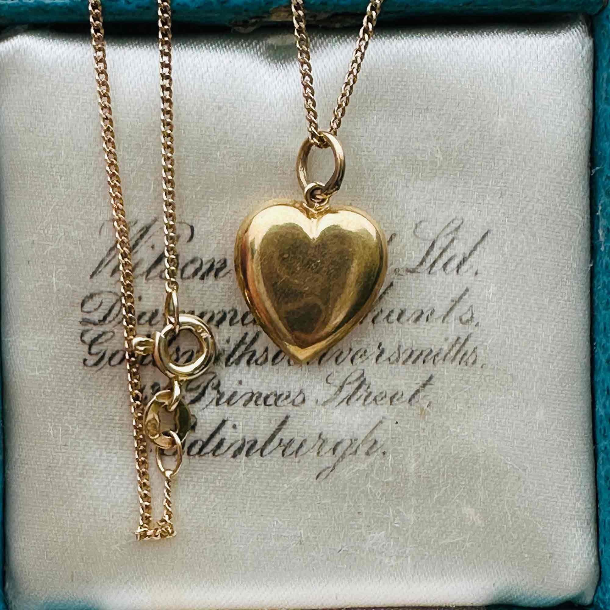 Gold Puffy Heart Necklace with Chain Dating 1942, displayed in a antique box.
