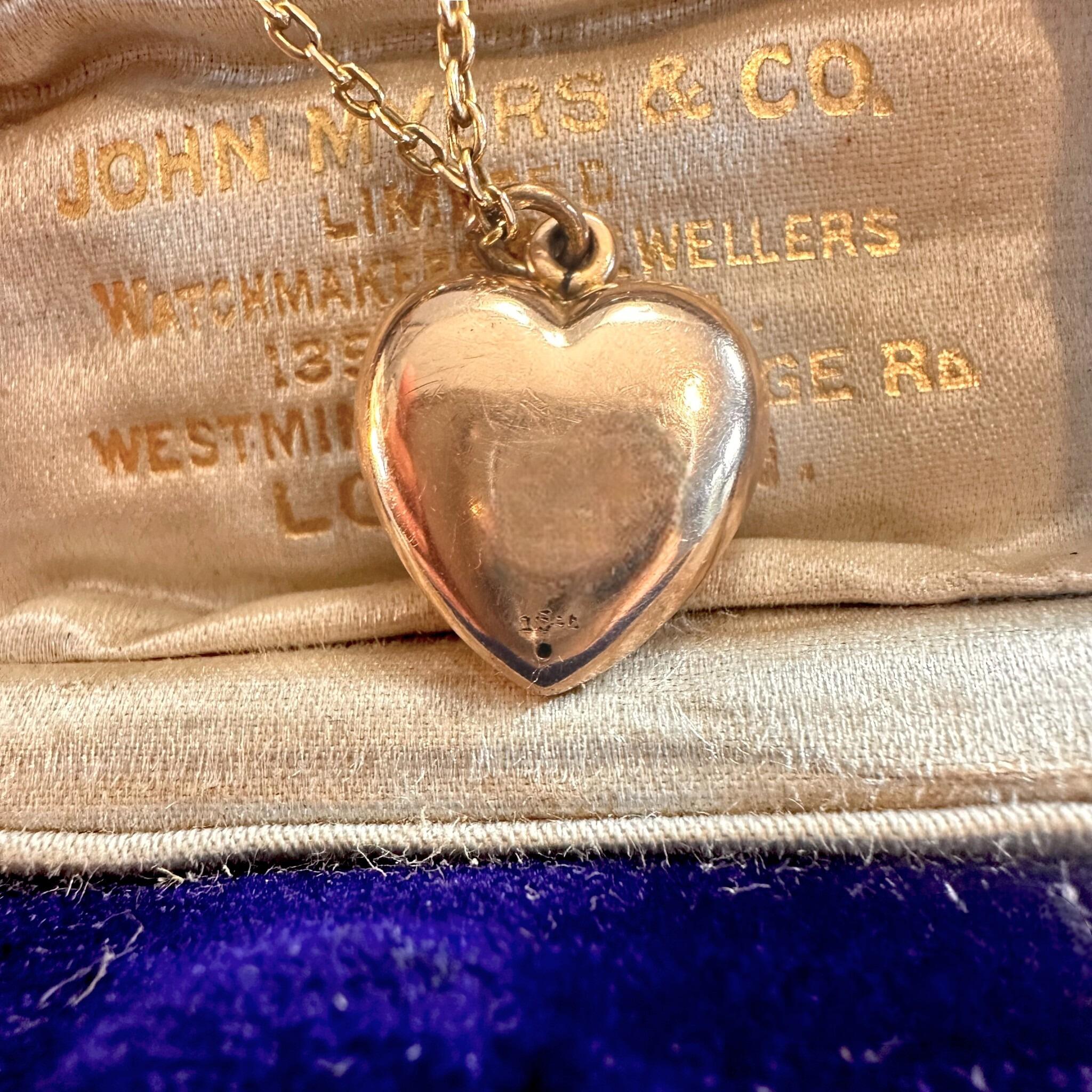 15ct Rose Gold Puffy Heart Pendant displayed in on antique box.