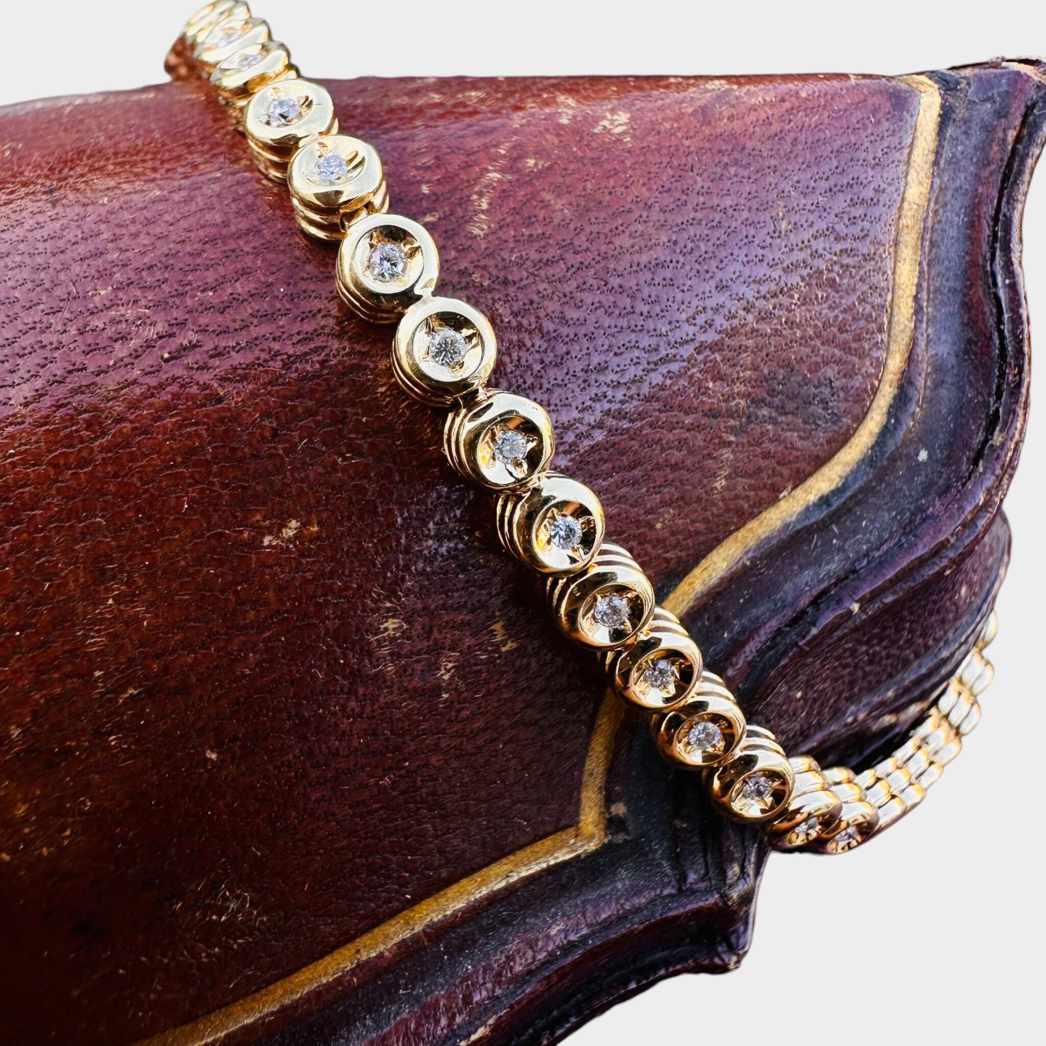 18ct Gold Diamond Line Tennis Bracelet wrapped around an antique box.