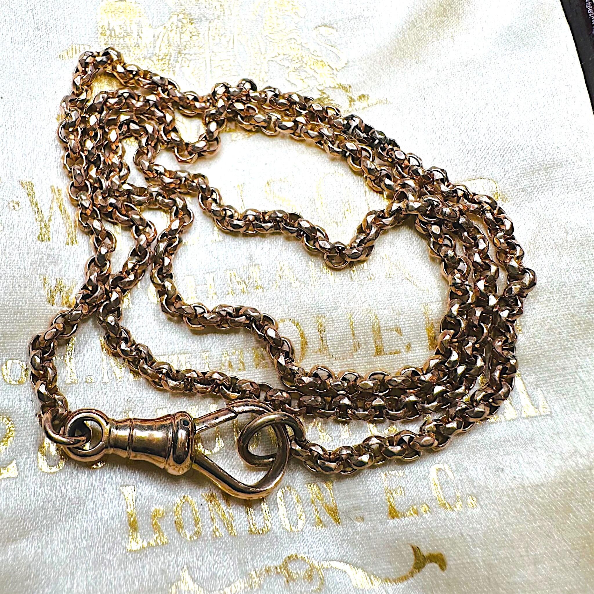 Rose Gold Belcher faceted Chain Necklace & Dog Clip displayed on antique box