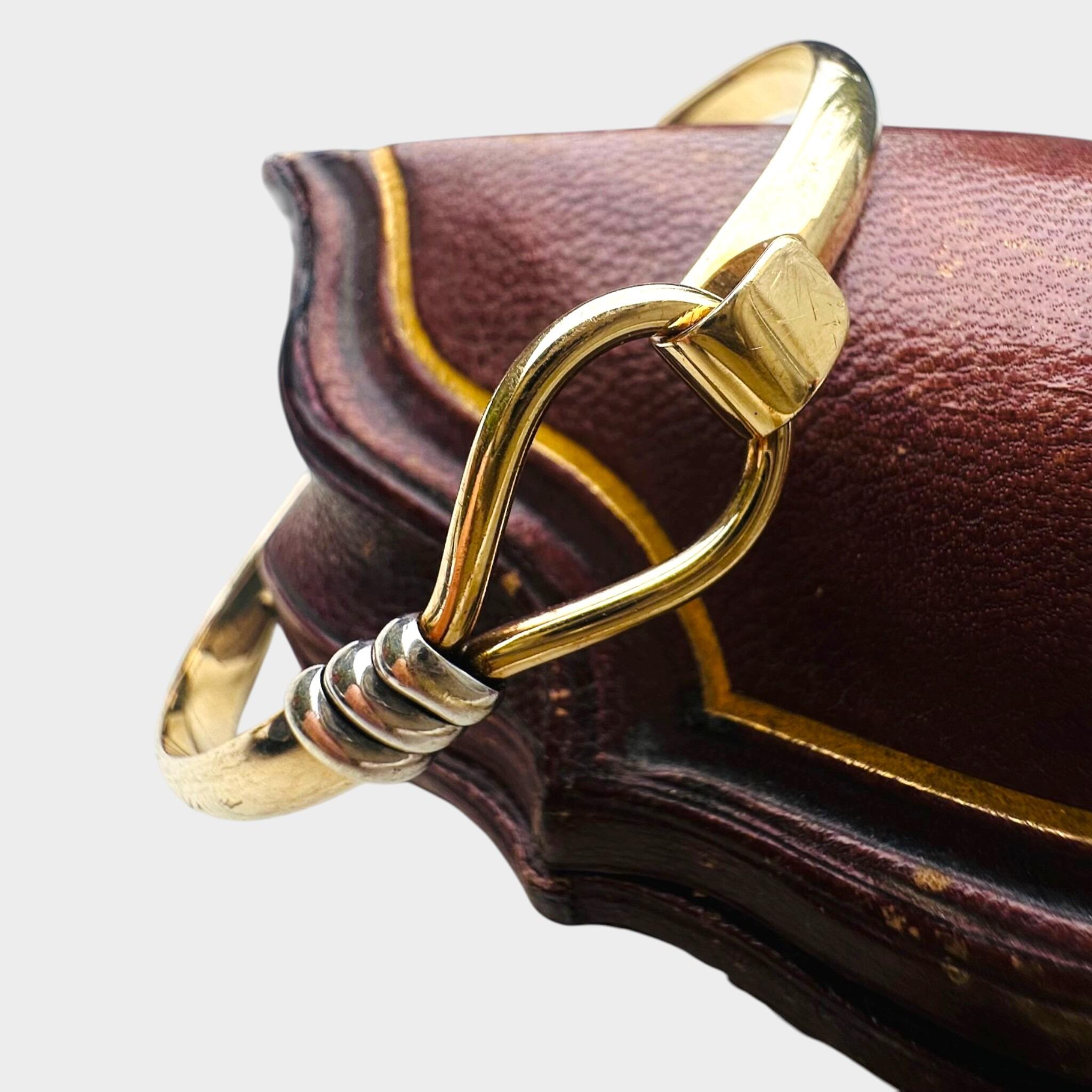 side profile of Vintage Two Tone Gold Bangle Bracelet displayed on antique box