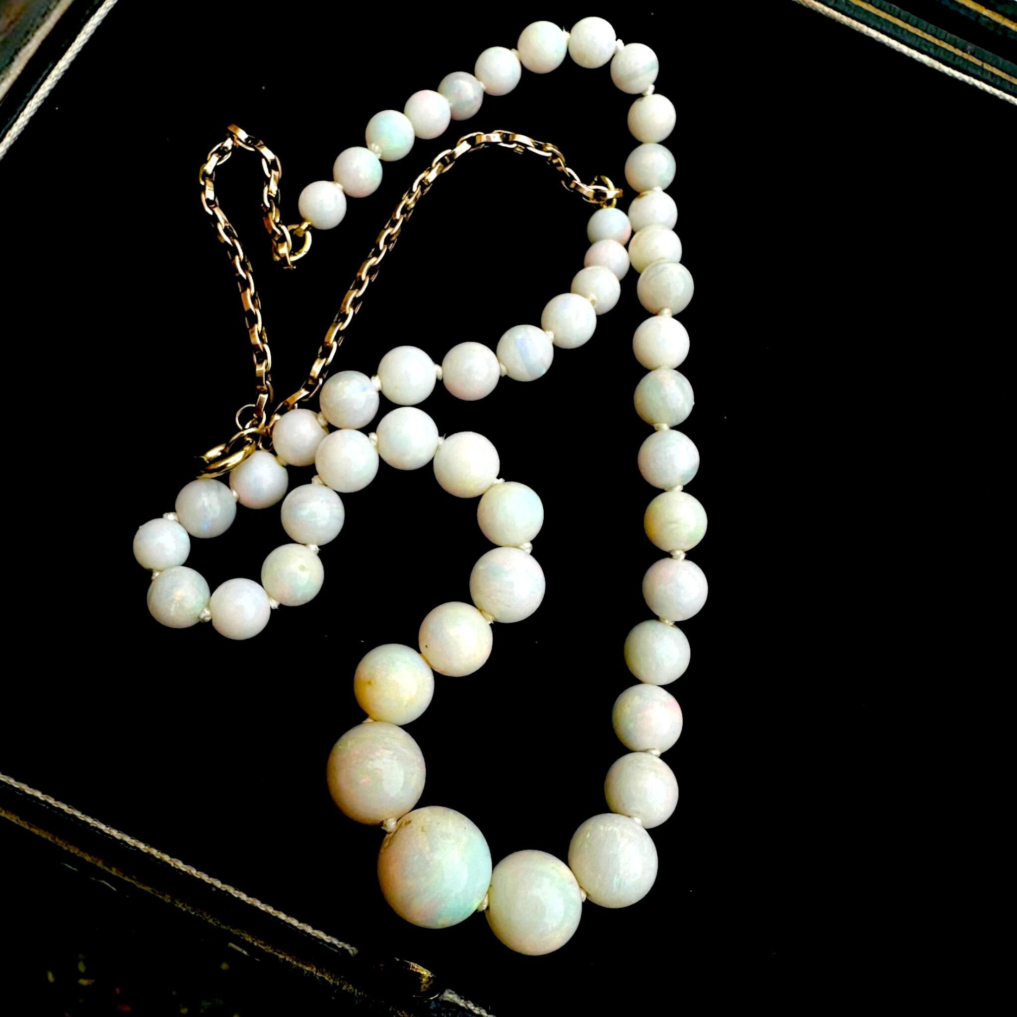 Art Deco Graduated Opal Bead & Gold Bike Chain Necklace displayed on black velvet