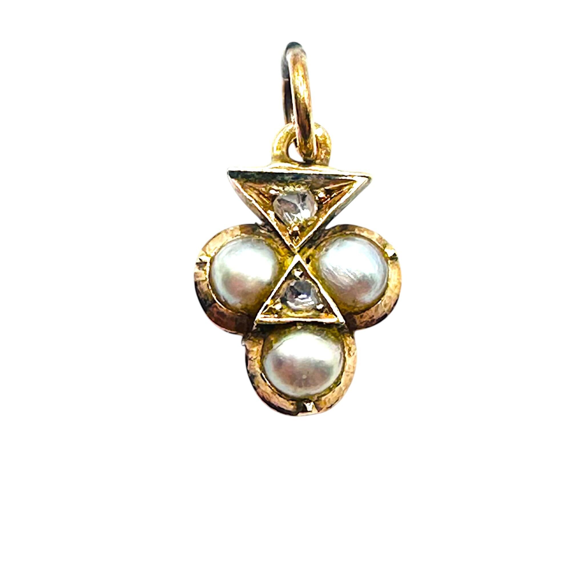 antique trefoil pearl and diamond charm, pendant on white background.