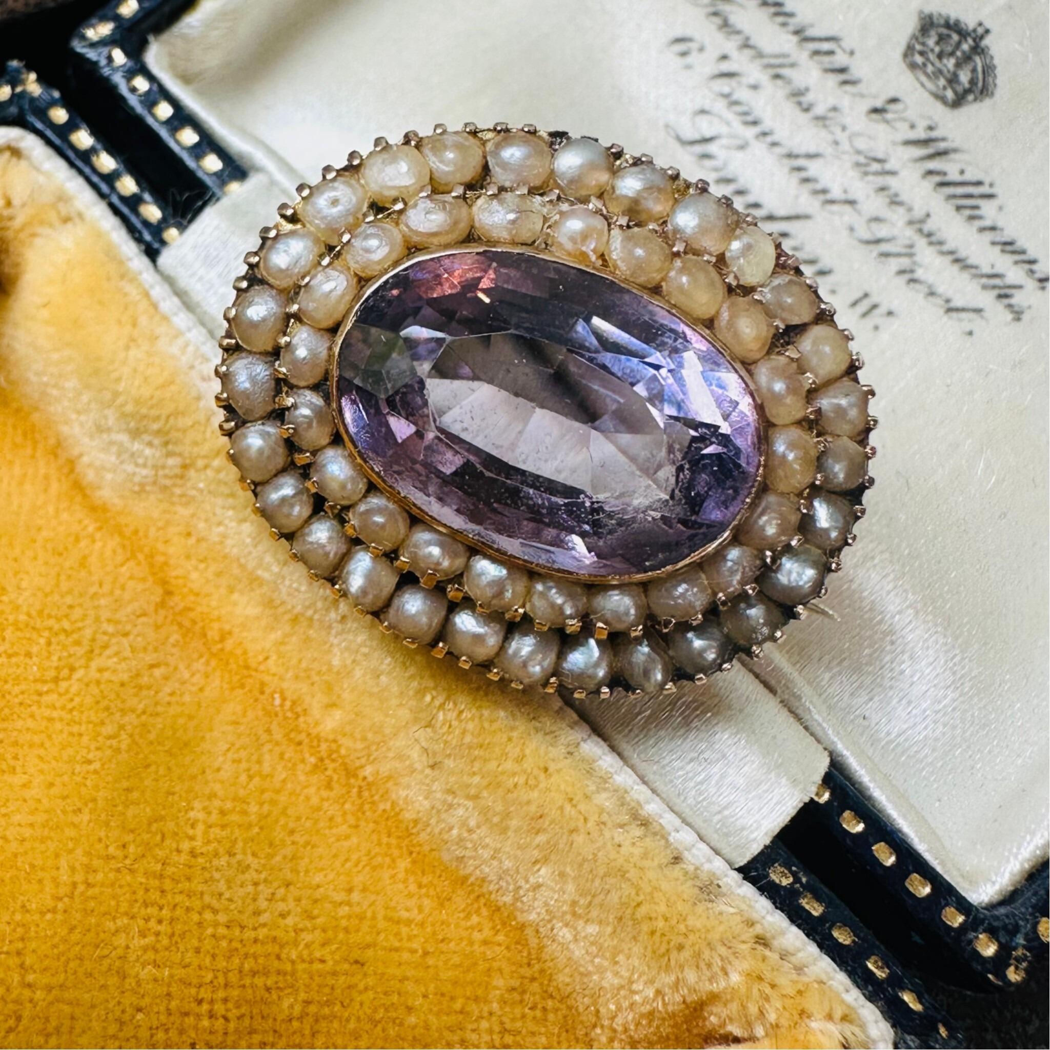 front view of Antique Victorian Gold Rose de France Amethyst & Seed Pearl Brooch laying on antique box