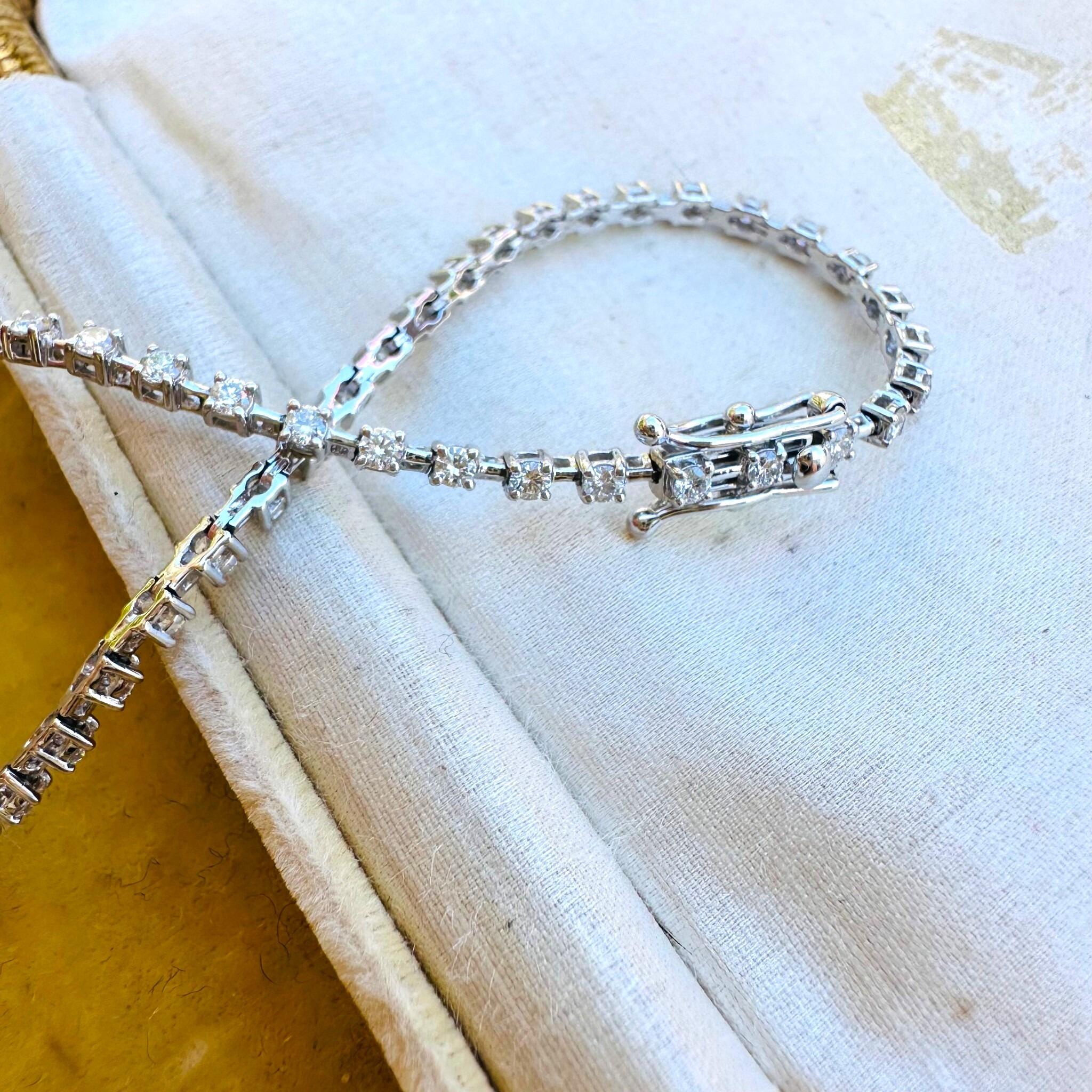 18K White Gold Diamond Tennis Bracelet laying on antique box