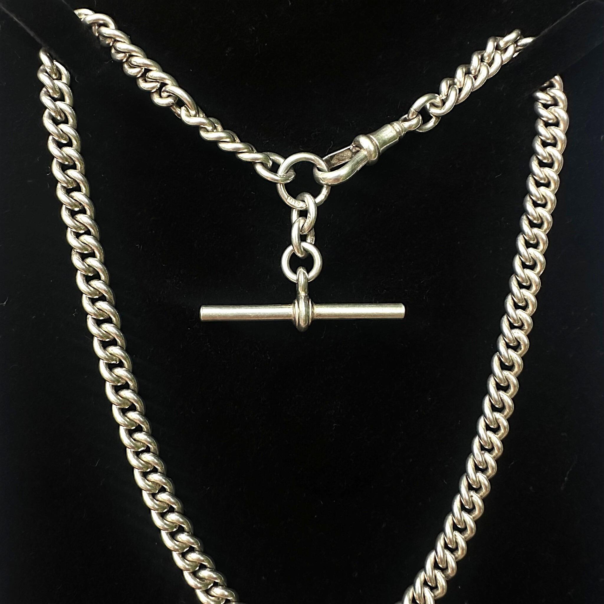 Antique Edwardian Sterling Silver Albert Chain, T Bar & Dog Clip displayed on black velvet