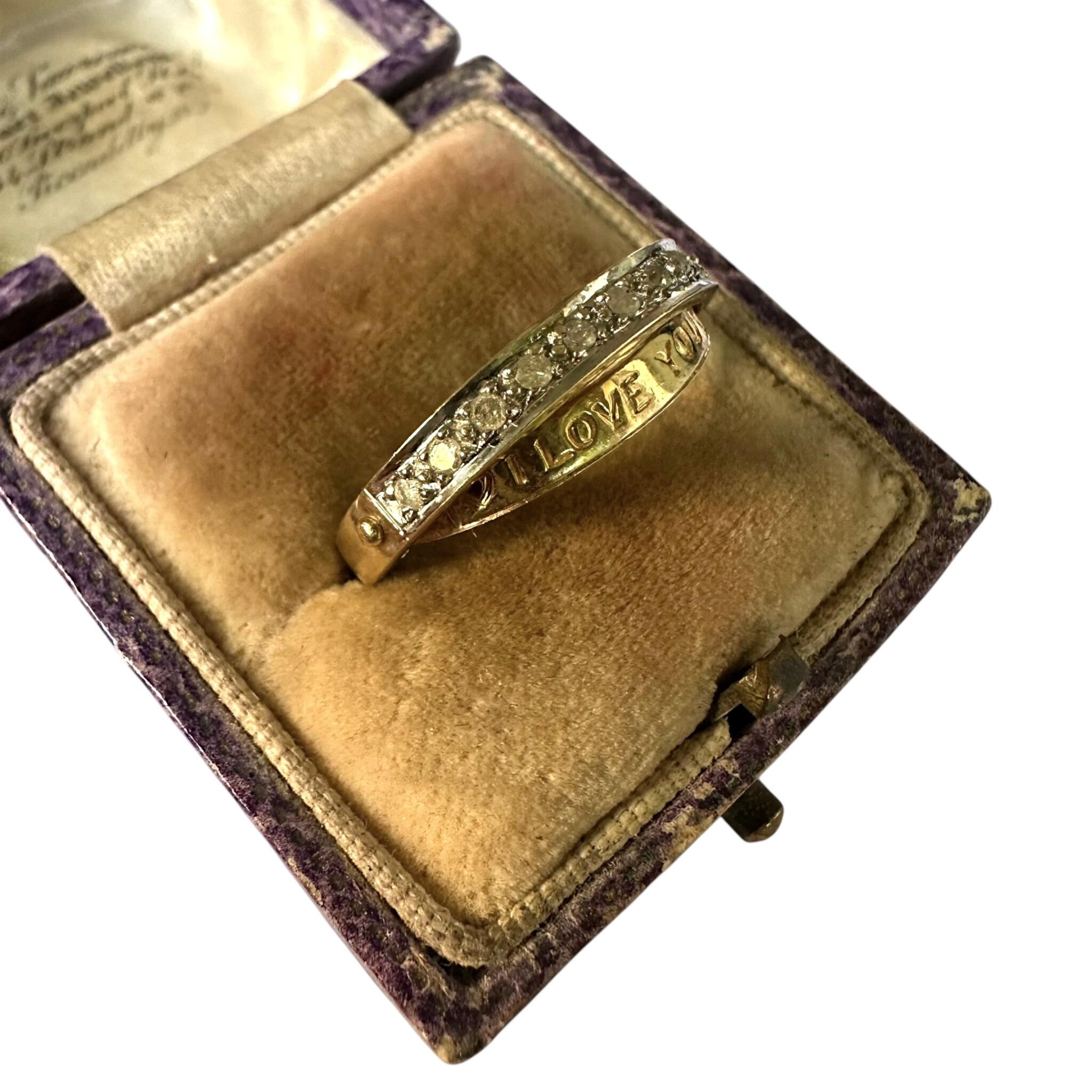 side view of Vintage Gold & Diamond Secret Message "I Love You" Ring displayed in antique box