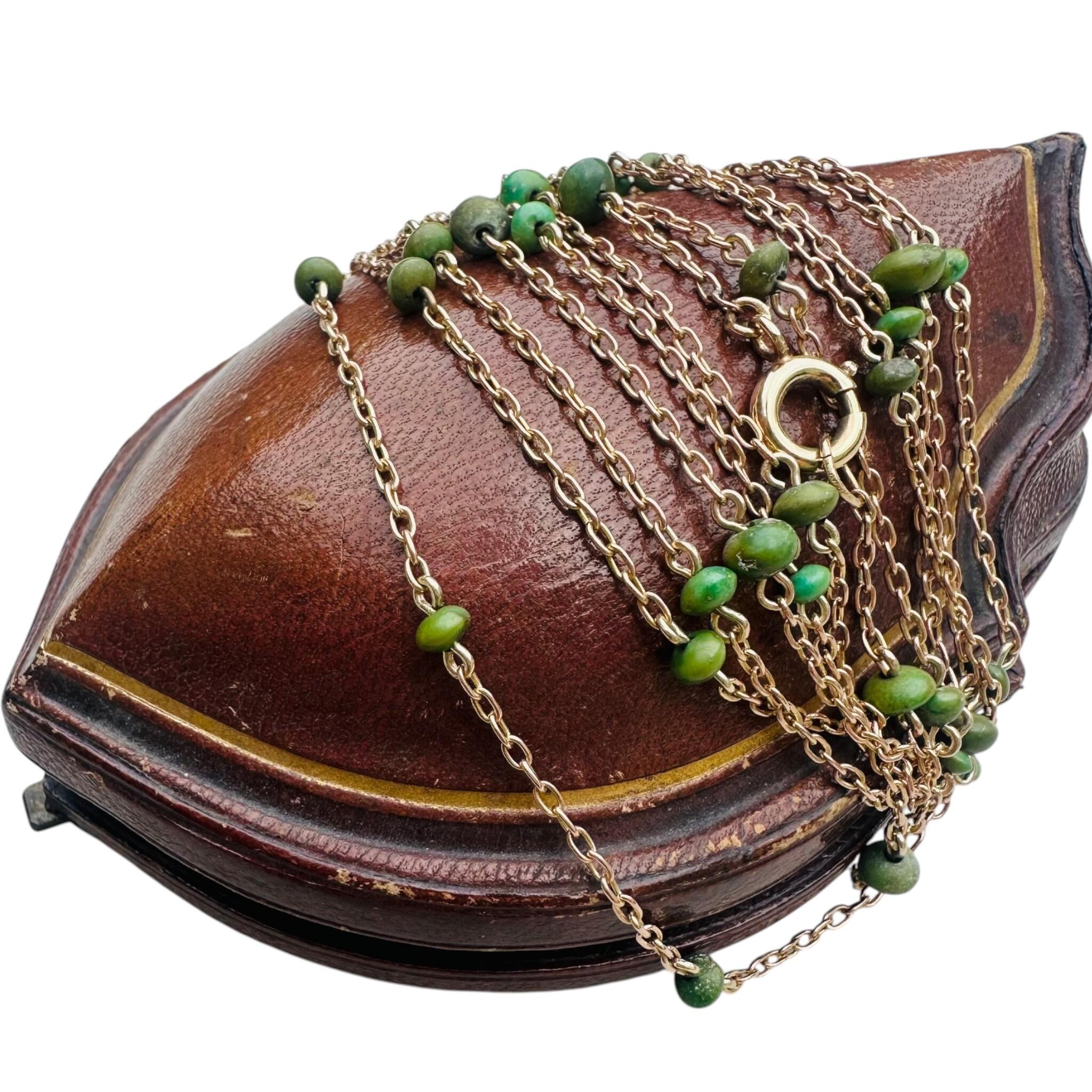 Antique Edwardian 9ct Rose Gold Turquoise Bead Guard Chain displayed on antique box with white background
