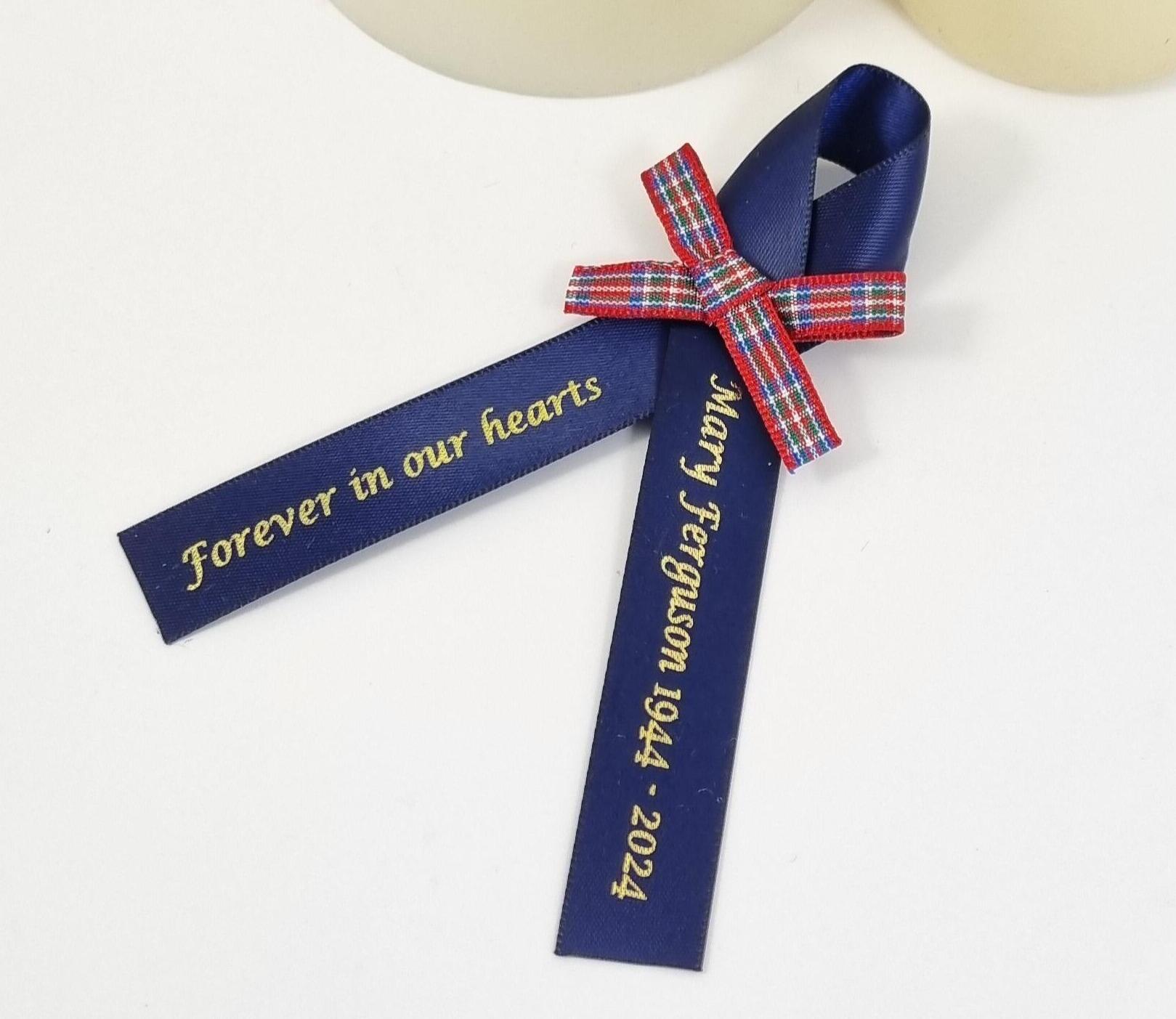 Tartan funeral ribbon with red Scottish Tartan bow
