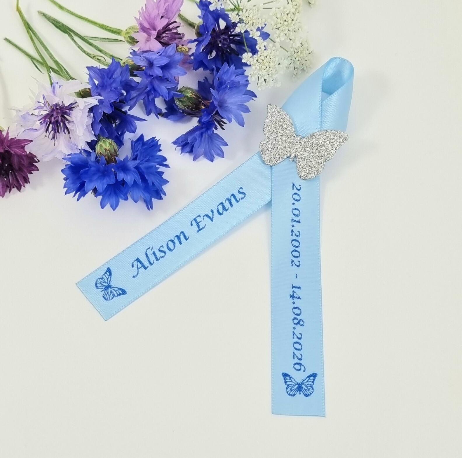 Silver Butterfly memorial Ribbon in baby blue ribbon with blue print for Funeral service