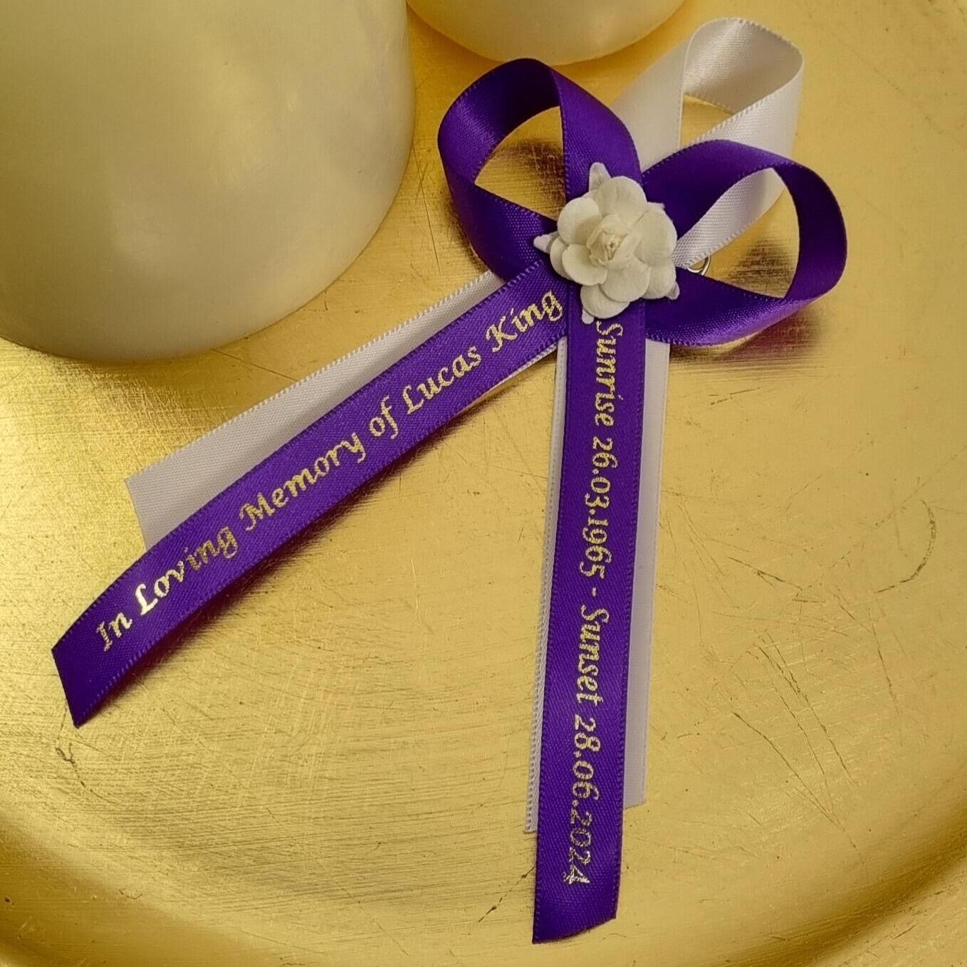 Purple funeral ribbon with rose to wear on lapel for memorial