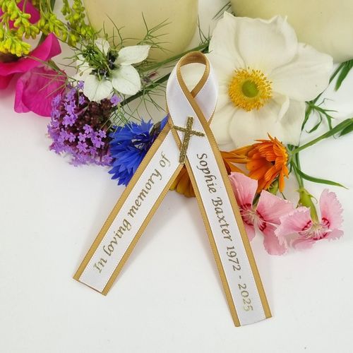 Memorial ribbon with gold cross. white and gold ribbons