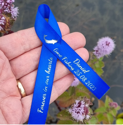 Gone fishing memorial ribbon in royal blue with silver print fish artwork