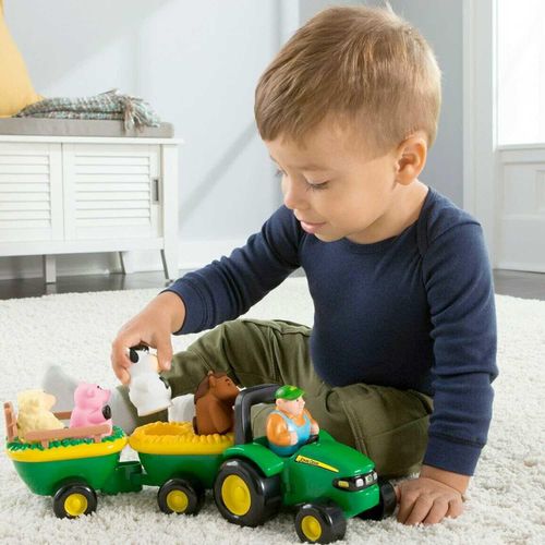 boy playing with John Deere branded farm vehicle from Incywincytoys