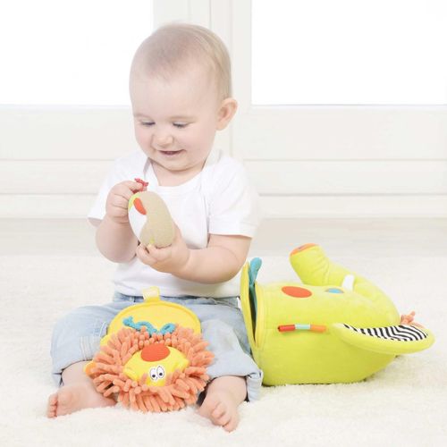 Baby playing with baby monkey toy