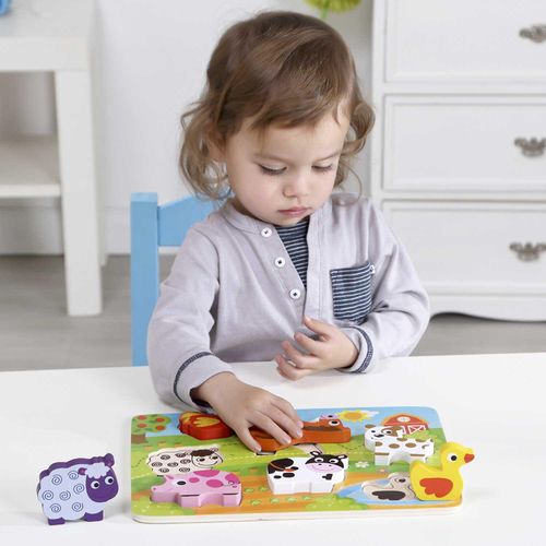 Little girl playing with puzzle