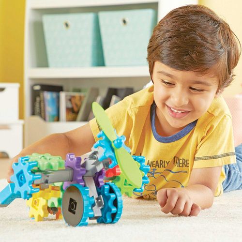 Child playing with Gears contruction toy