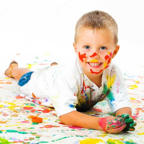 Child covered with paint