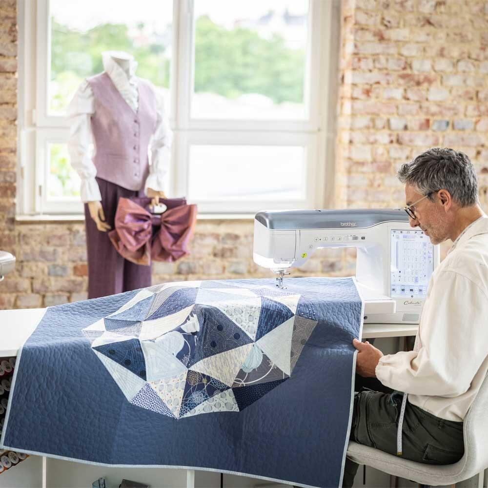 Brother celeste CX1 sewing machine with a quilt that has been sewn