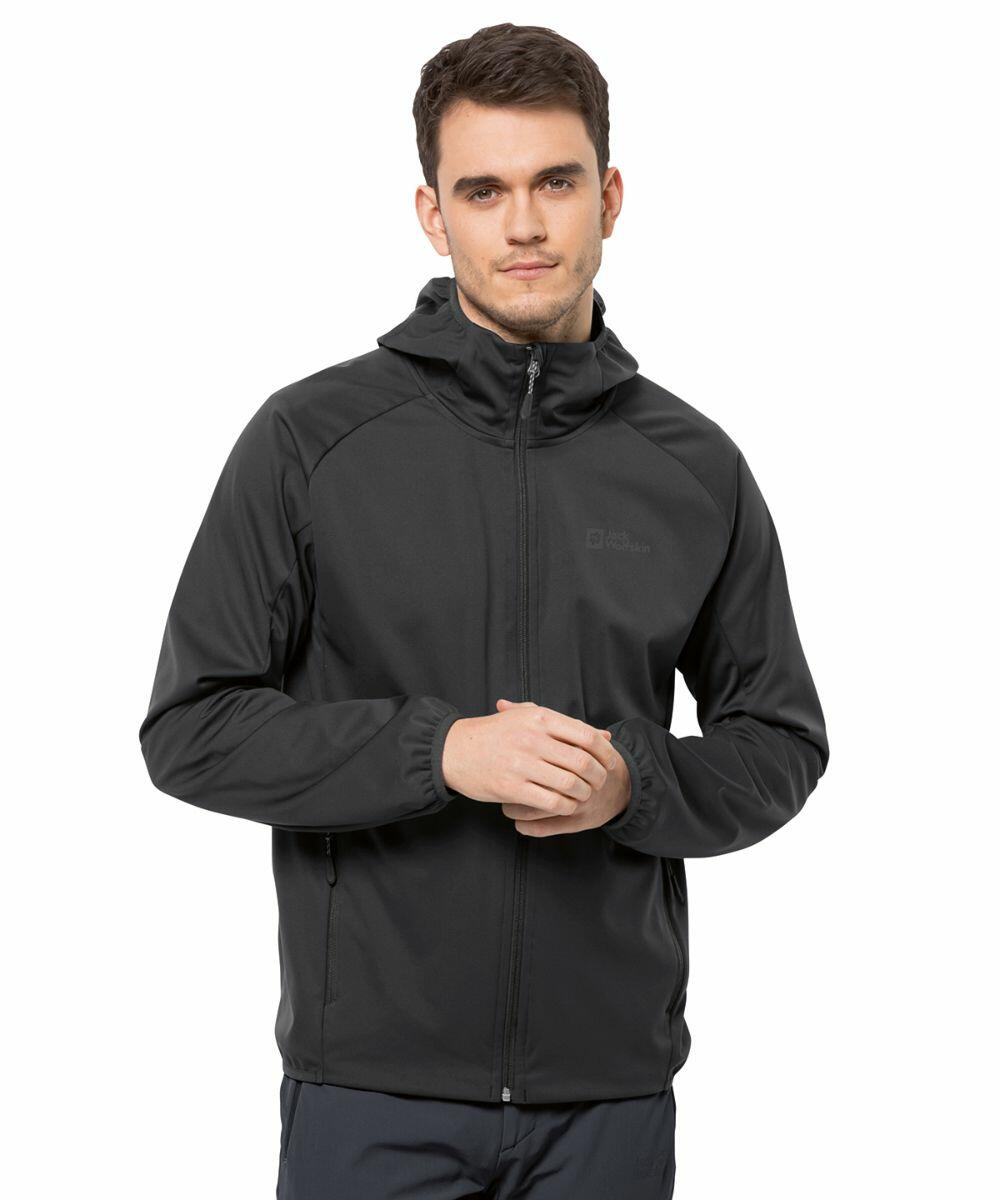 A man wearing a black JW016 hooded jacket by Jack Wolfskin stands with his hands clasped in front of him against a plain white background.